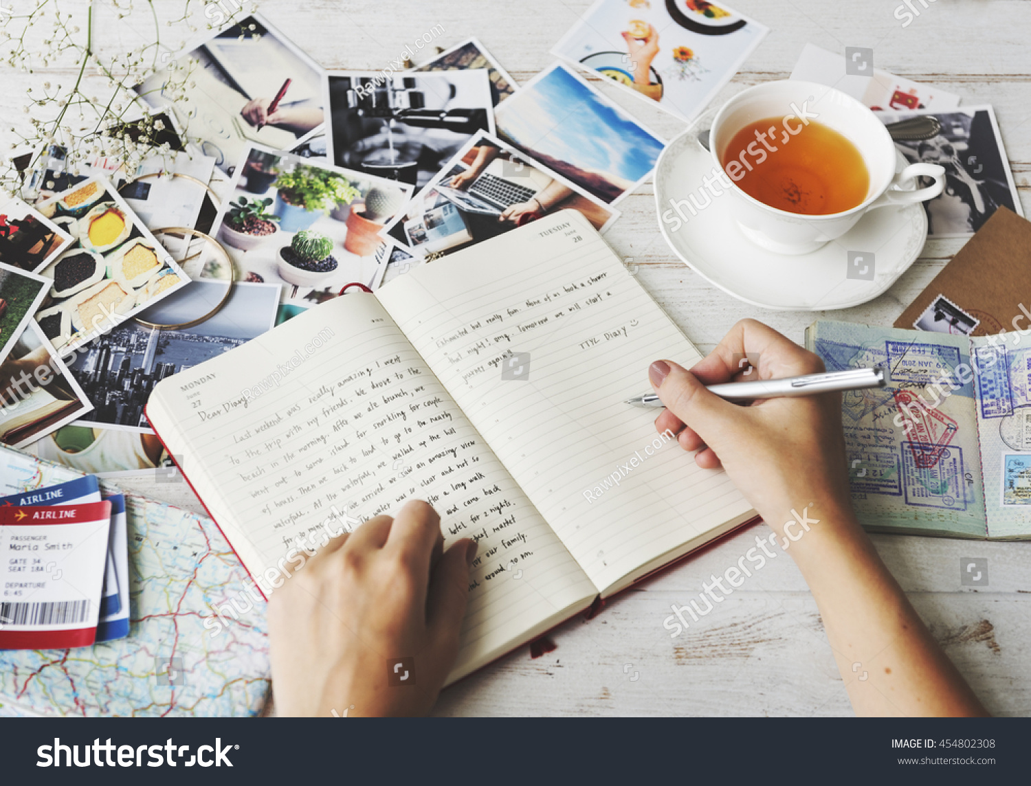 Hands Writing Travel Journal Tea Concept #454802308