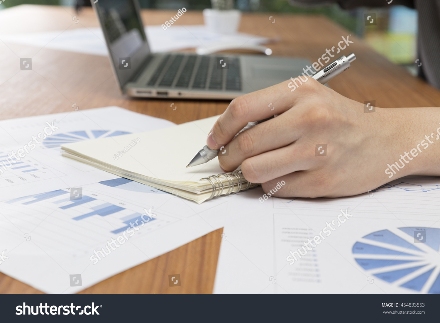 businessman working with document and computer notebook laptop on office desk #454833553