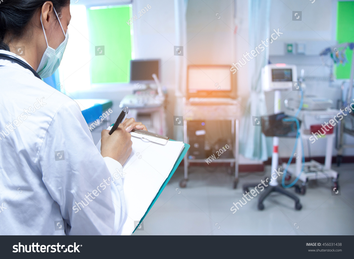 Doctor writing a medical prescription #456031438
