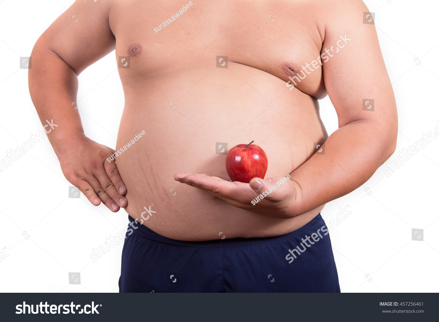 fat man with a apple in his hand. concept of healthy #457256461