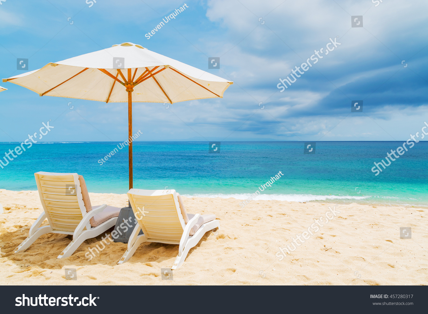 Sunshade and outdoor lounger at a tropical resort in Asia #457280317