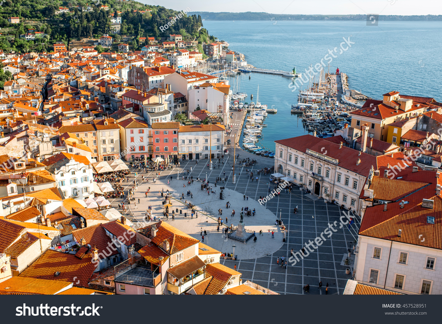 Beautiful aerial view on Piran town with Tartini main square, ancient buildings with red roofs and Adriatic sea in southwestern Slovenia #457528951