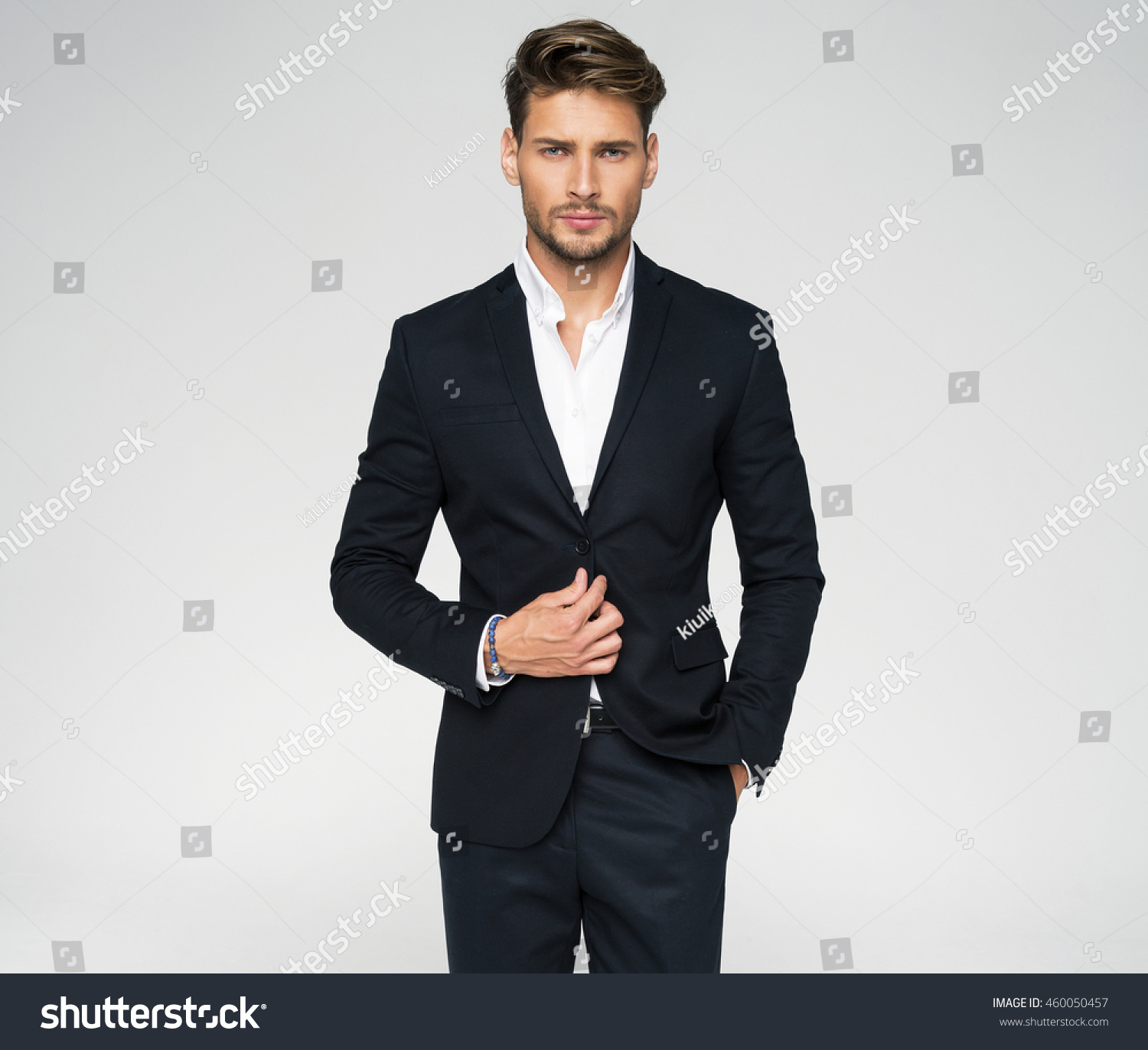 Portrait of handsome man in black suit #460050457