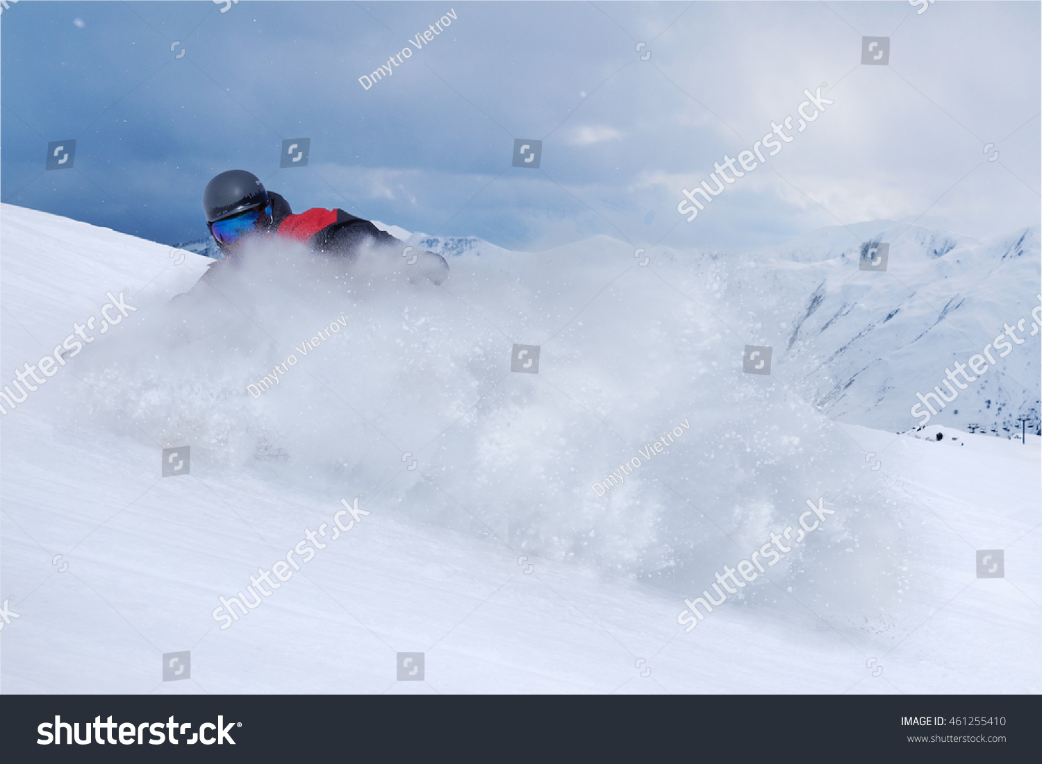 Snowboarder riding fast on a dry snow on freeride slope. #461255410