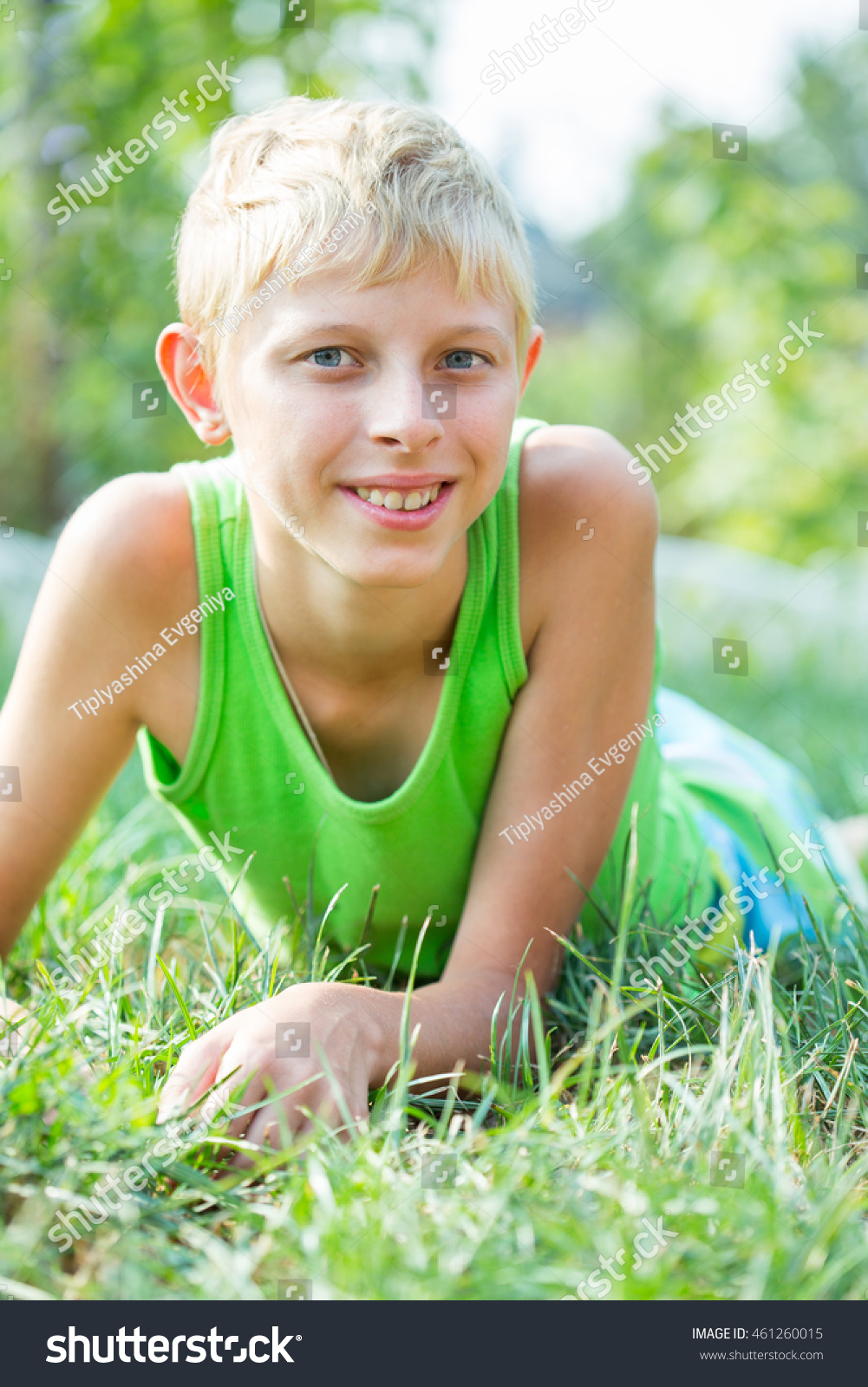 Portrait of a boy fourteen years of age in the grass #461260015