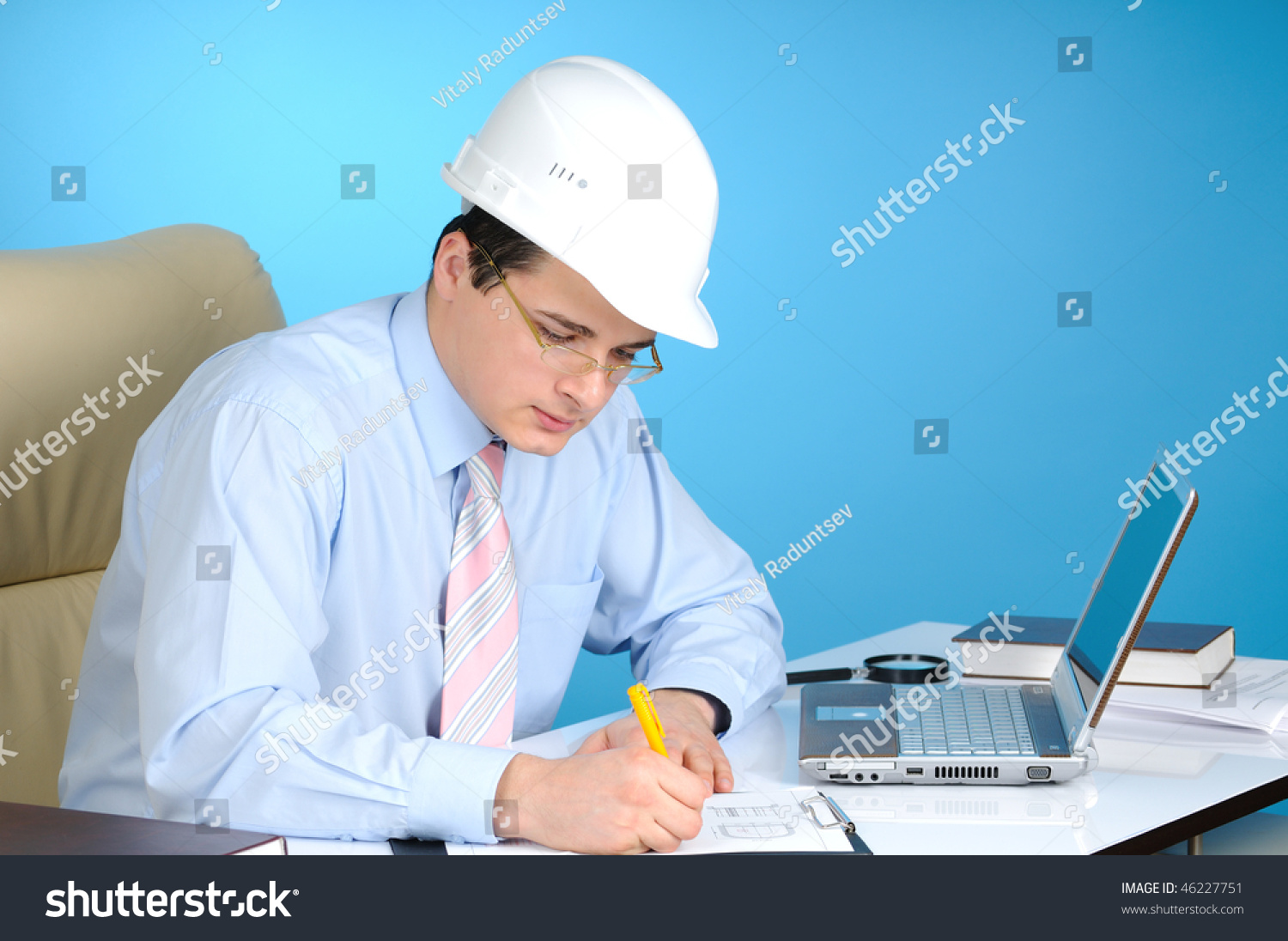 An engineer with white hard hat at work  on blue background #46227751
