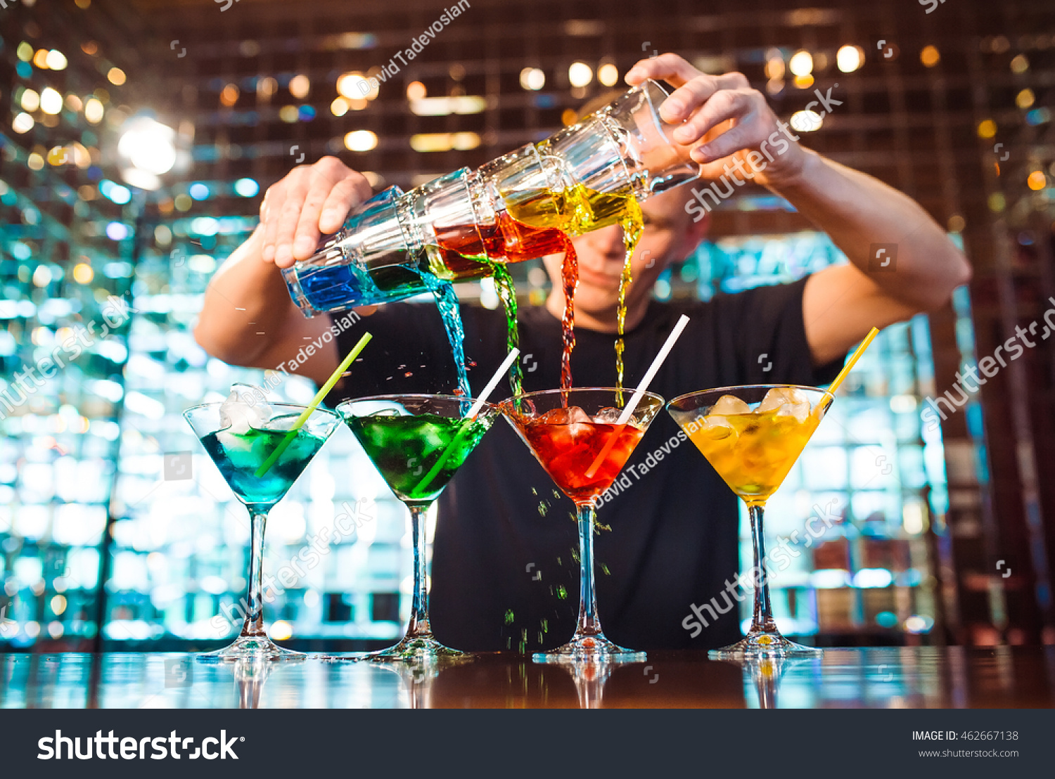 Barman show. Bartender pours alcoholic cocktails. #462667138