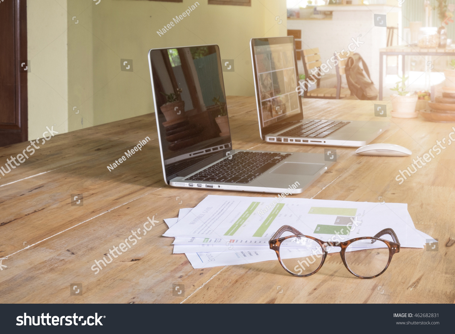 Office workplace with laptop with document statistics and glasses wood table #462682831