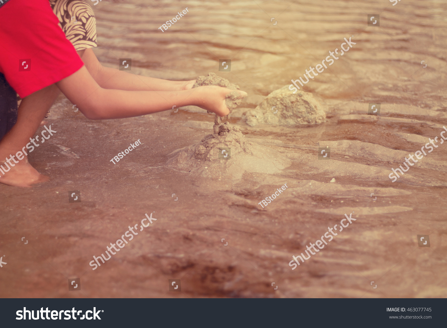 Little children playing with sand on the beach in the summer  #463077745