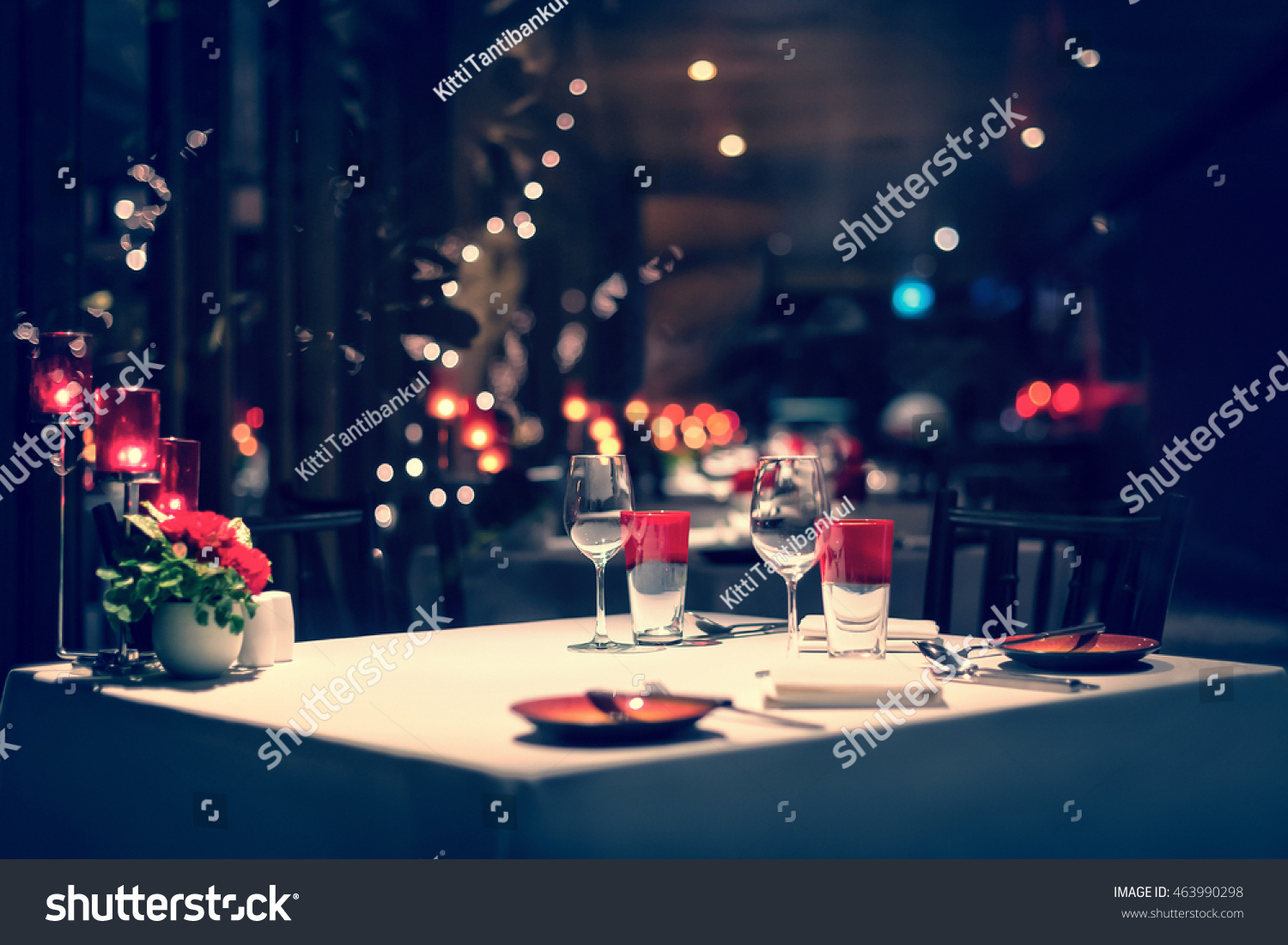 romantic dinner setup, red decoration with candle light in a restaurant. Selective focus. Vintage color. #463990298