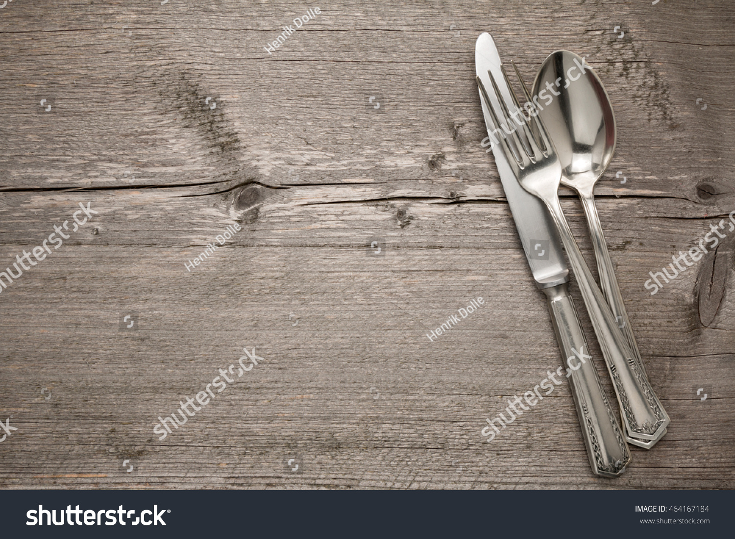 Cutlery is in a napkin wrapped on an old table #464167184