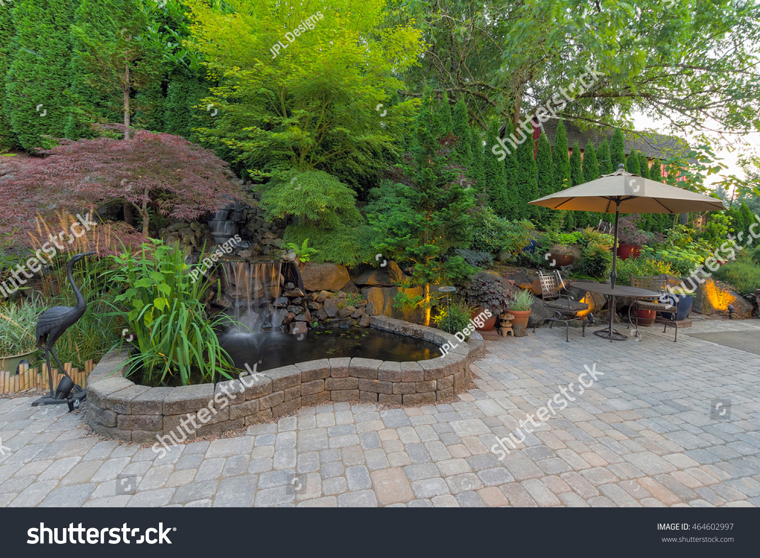 Backyard Garden landscaping with waterfall pond trees plants trellis decor furniture brick pavers patio hardscape #464602997