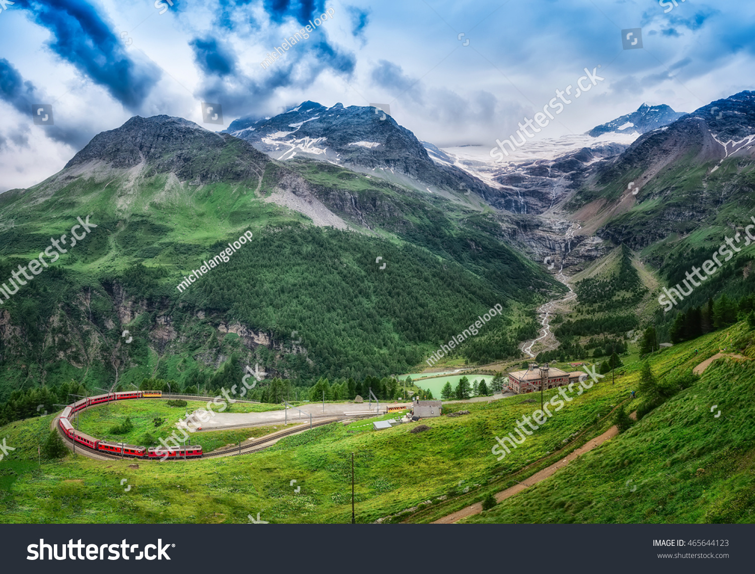 Red train Bernina Express to the passage in the mountains in the summer #465644123