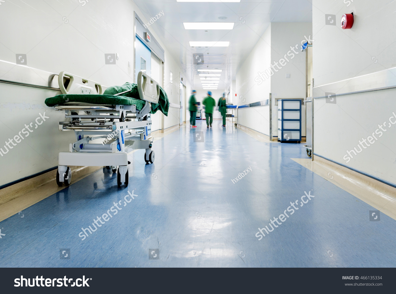 Doctors and nurses walking in hospital hallway, blurred motion.  #466135334