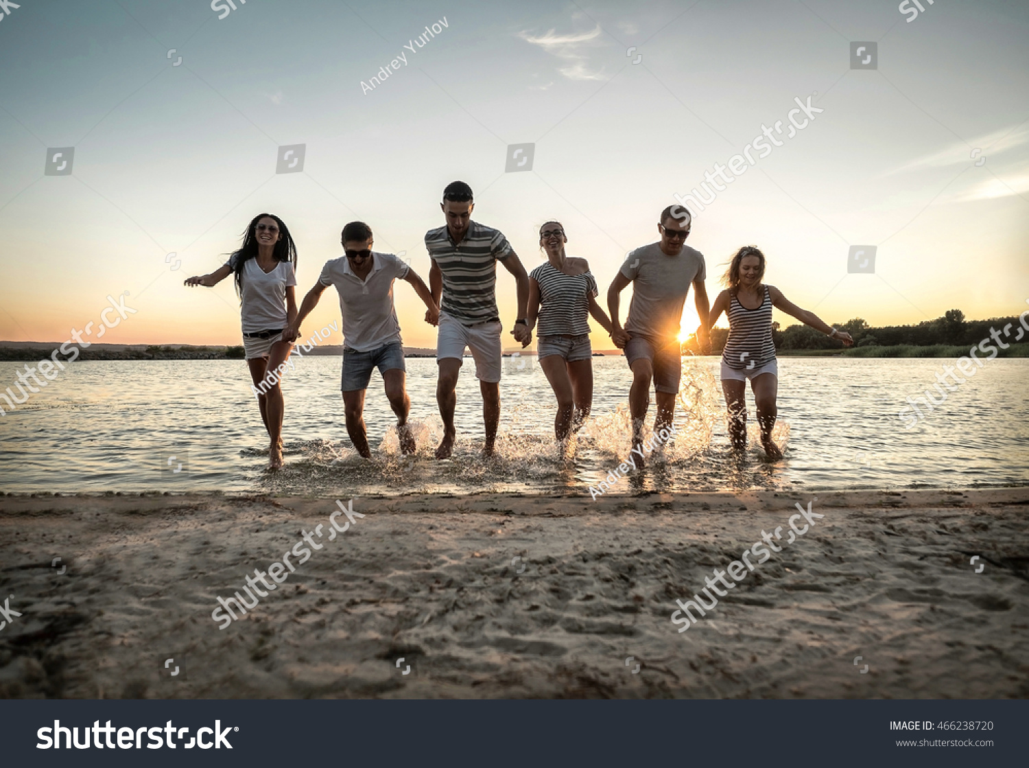 Silhouette of group young people on the beach. #466238720