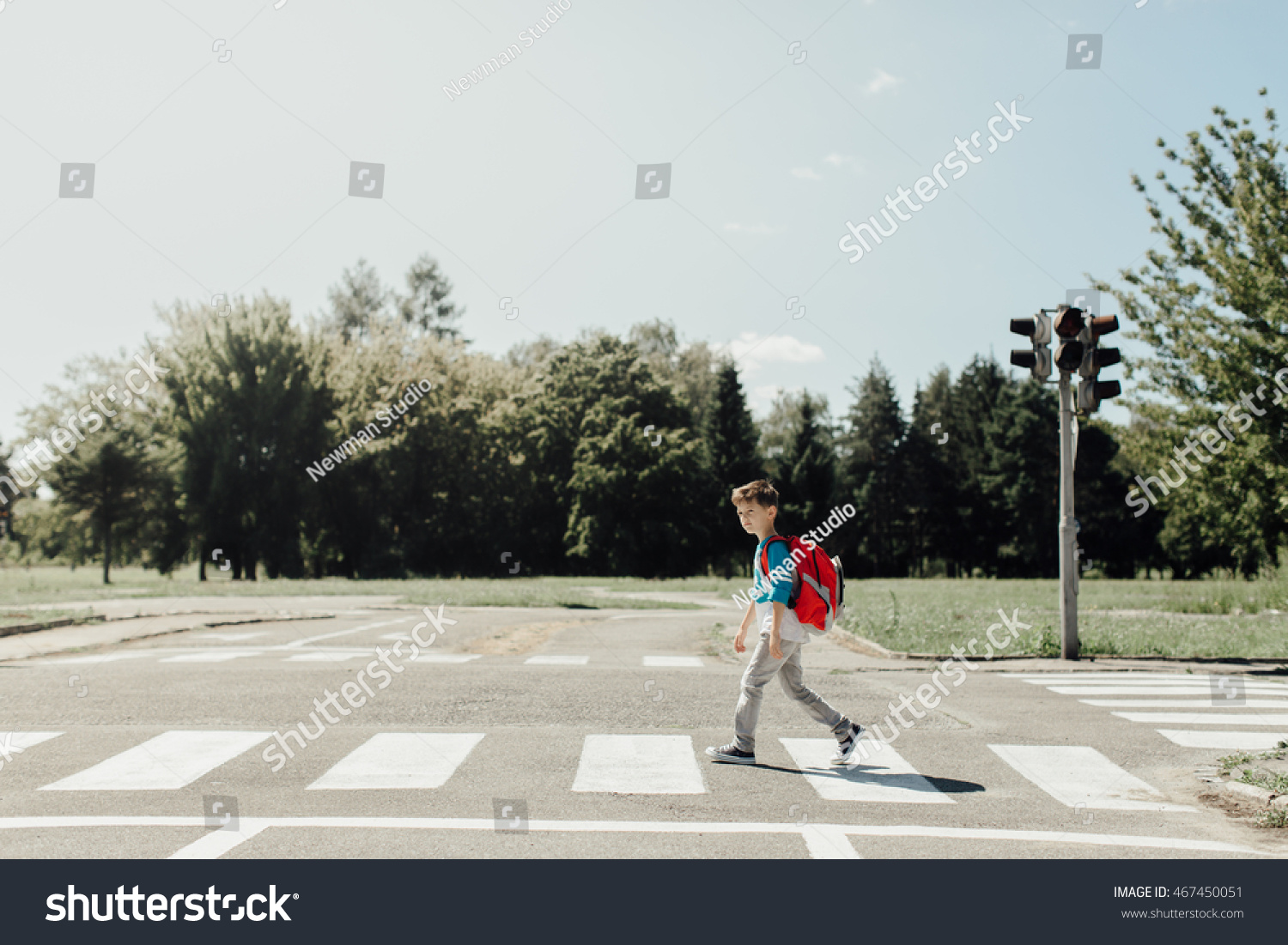 Schoolboy crossing road on way to school #467450051