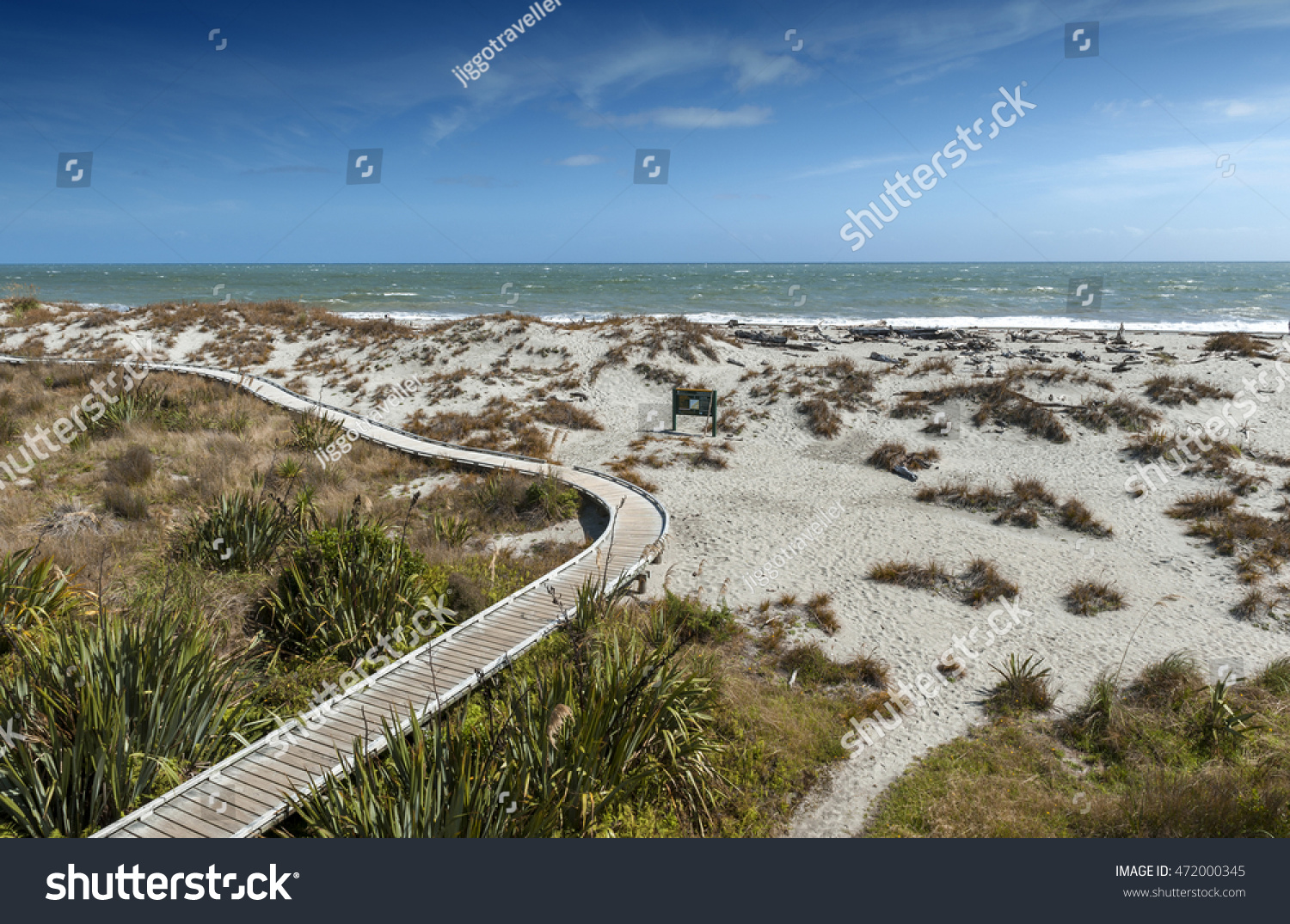 Wooden walkway by the beach at Tauparikaka Marine Reserve, Haast, New Zealand #472000345