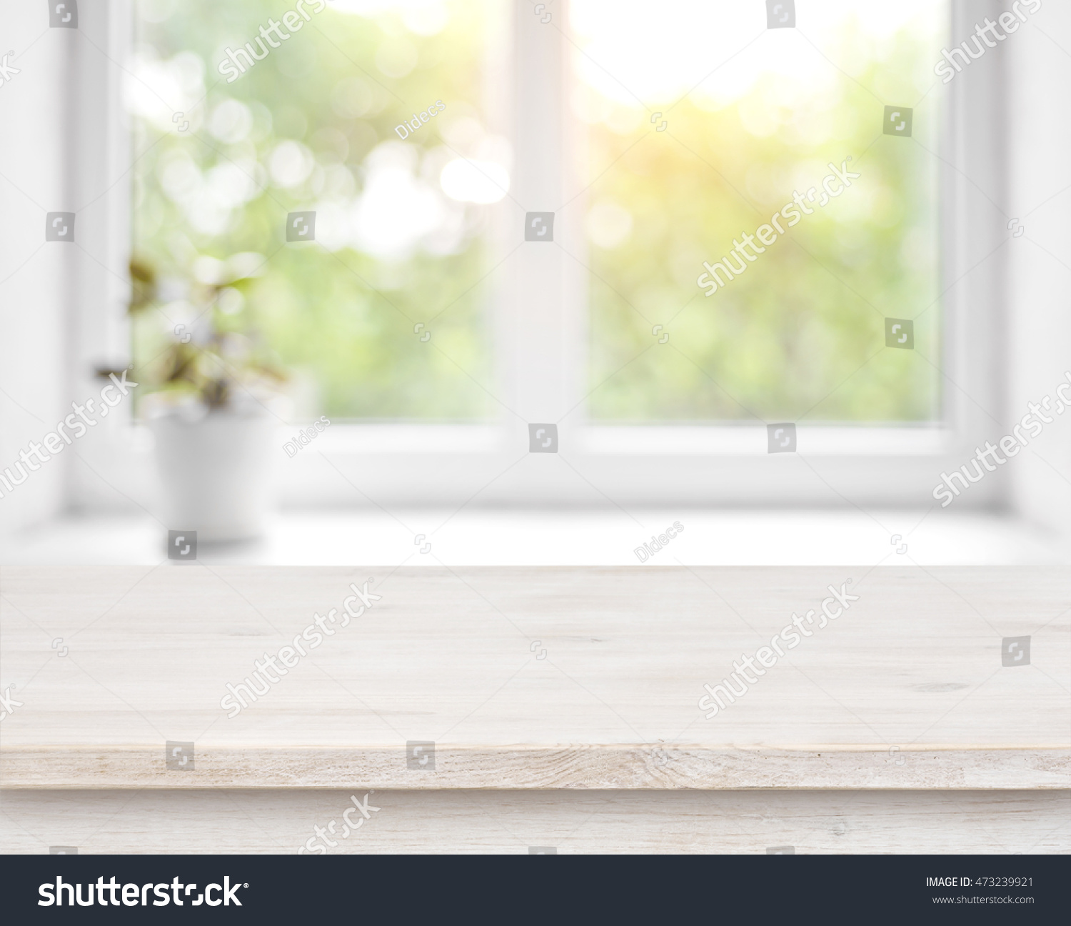 Wooden table on defocused summer window with flower pot background #473239921