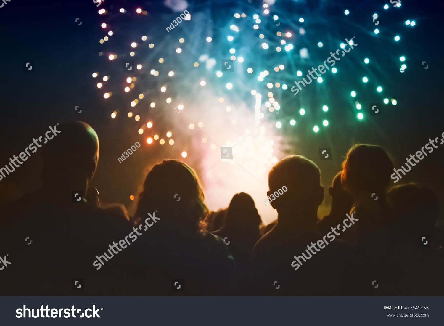 Crowd watching fireworks and celebrating #477649855