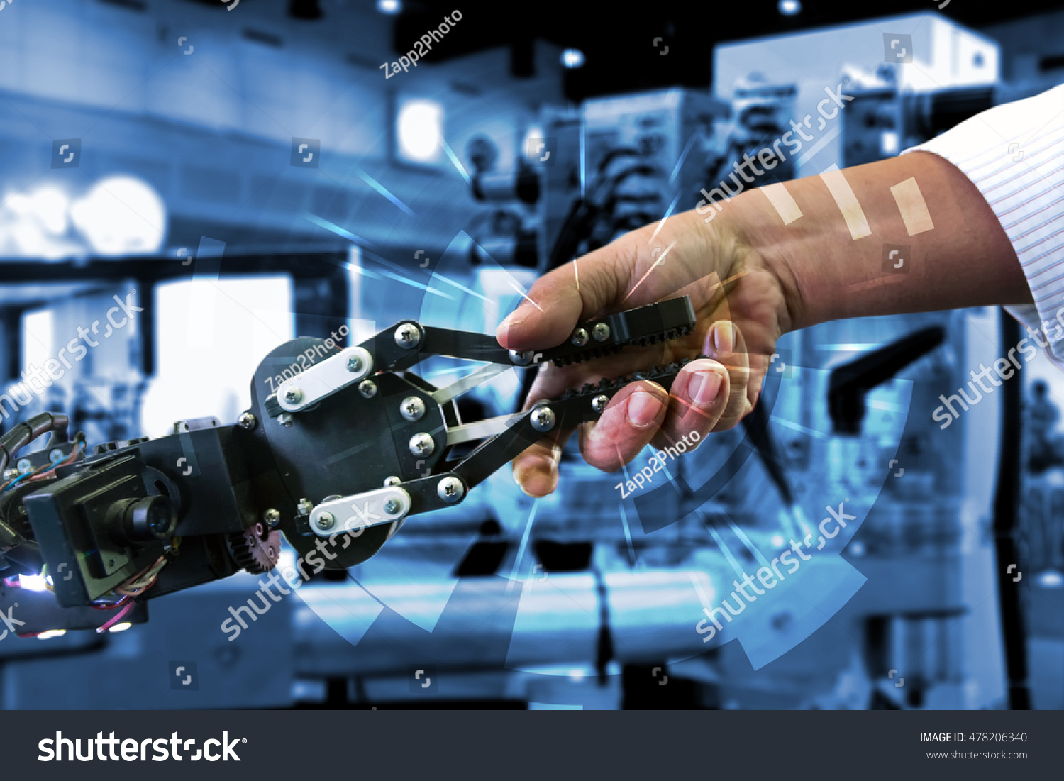 Cyber communication and robotic concepts. Industrial 4.0 Cyber Physical Systems concept. Robot and Engineerer human holding hand with handshake and graphic for background #478206340