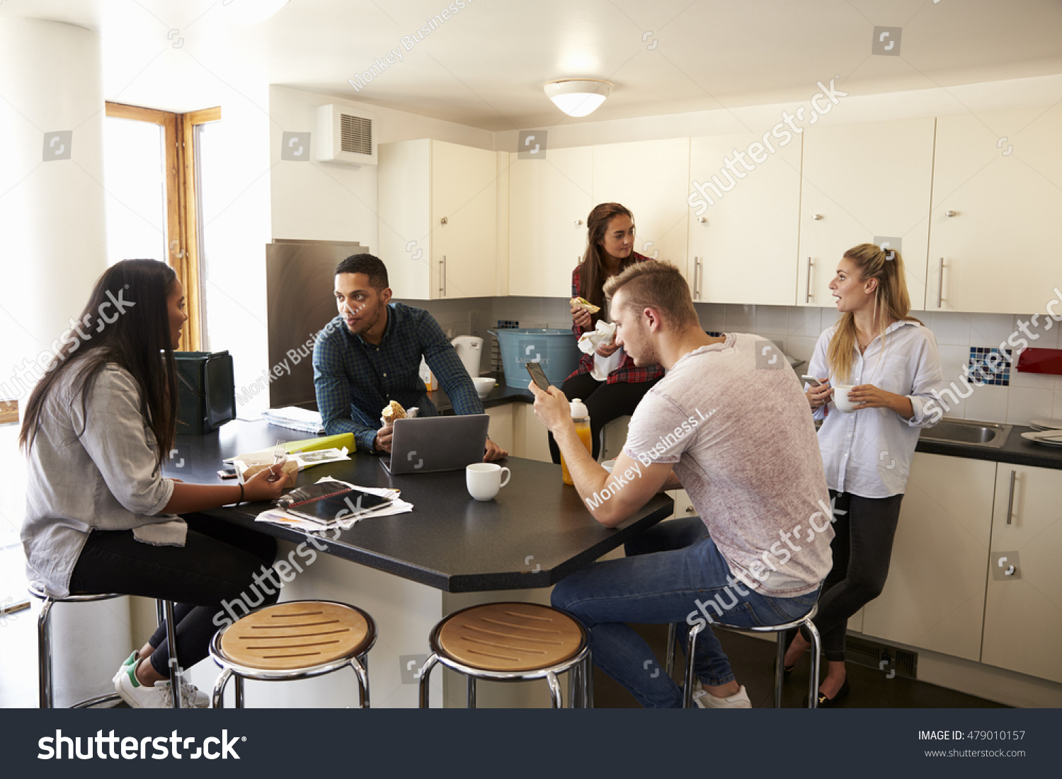 Students Relaxing In Kitchen Of Shared Accommodation #479010157