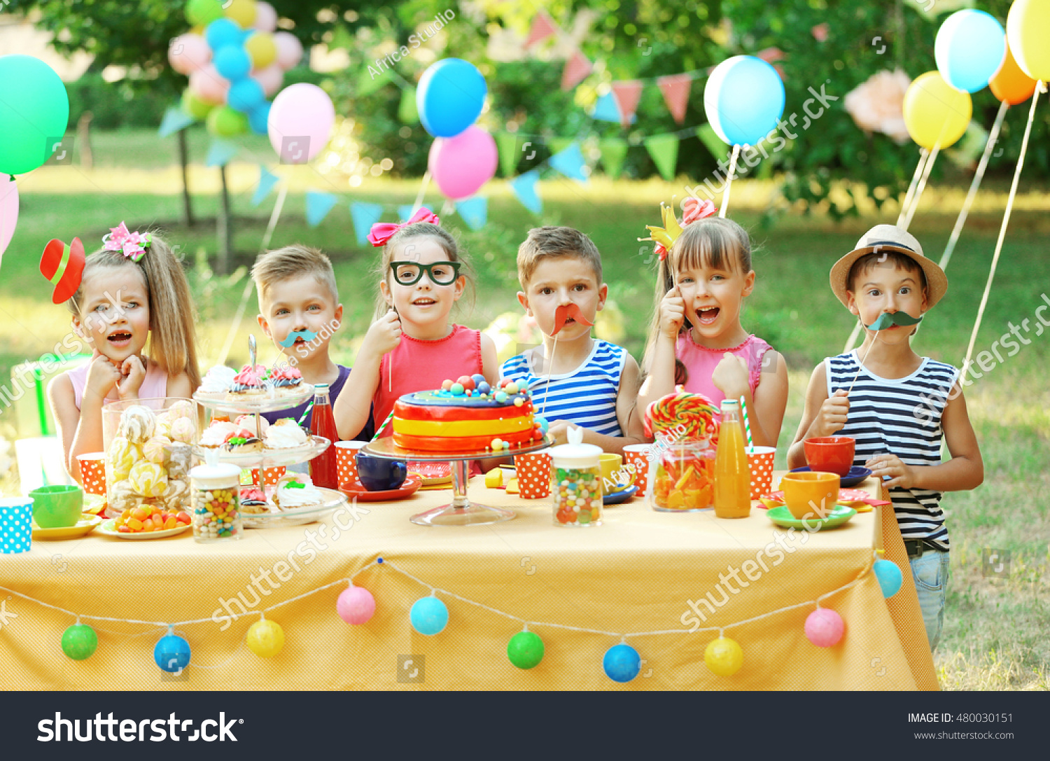 Children celebrating birthday in park #480030151