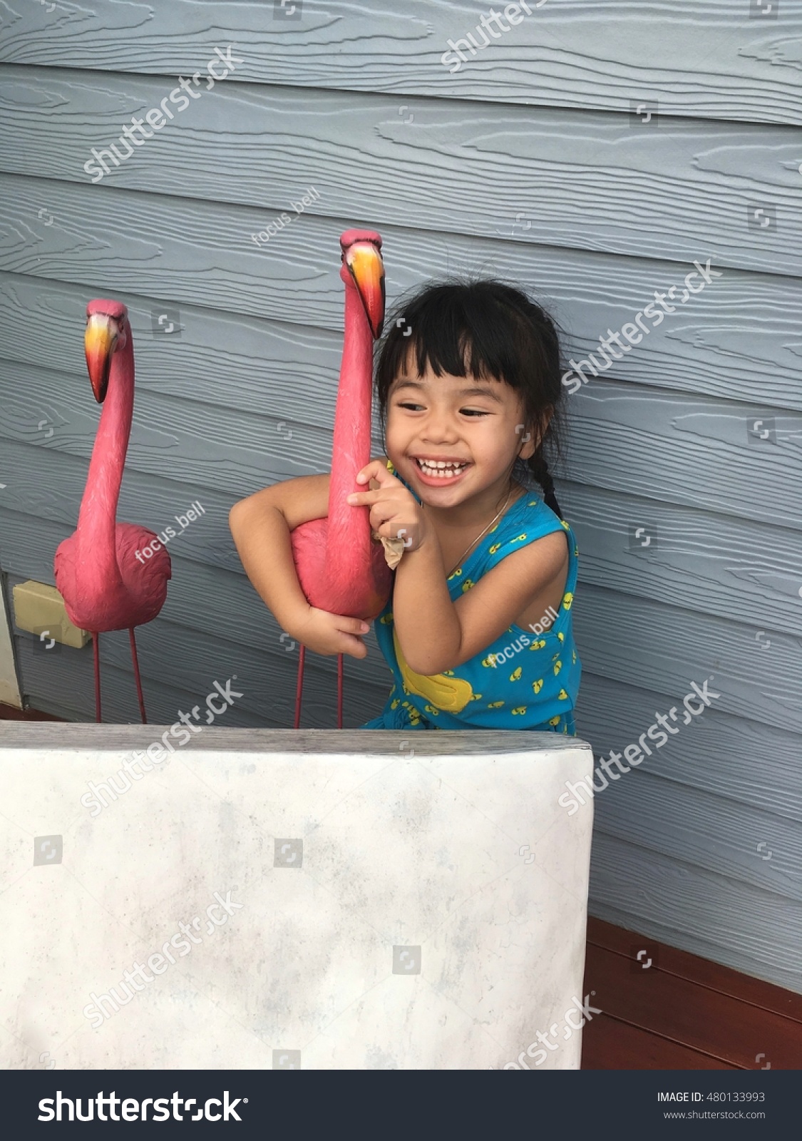 The girl Asia hugging bird doll #480133993
