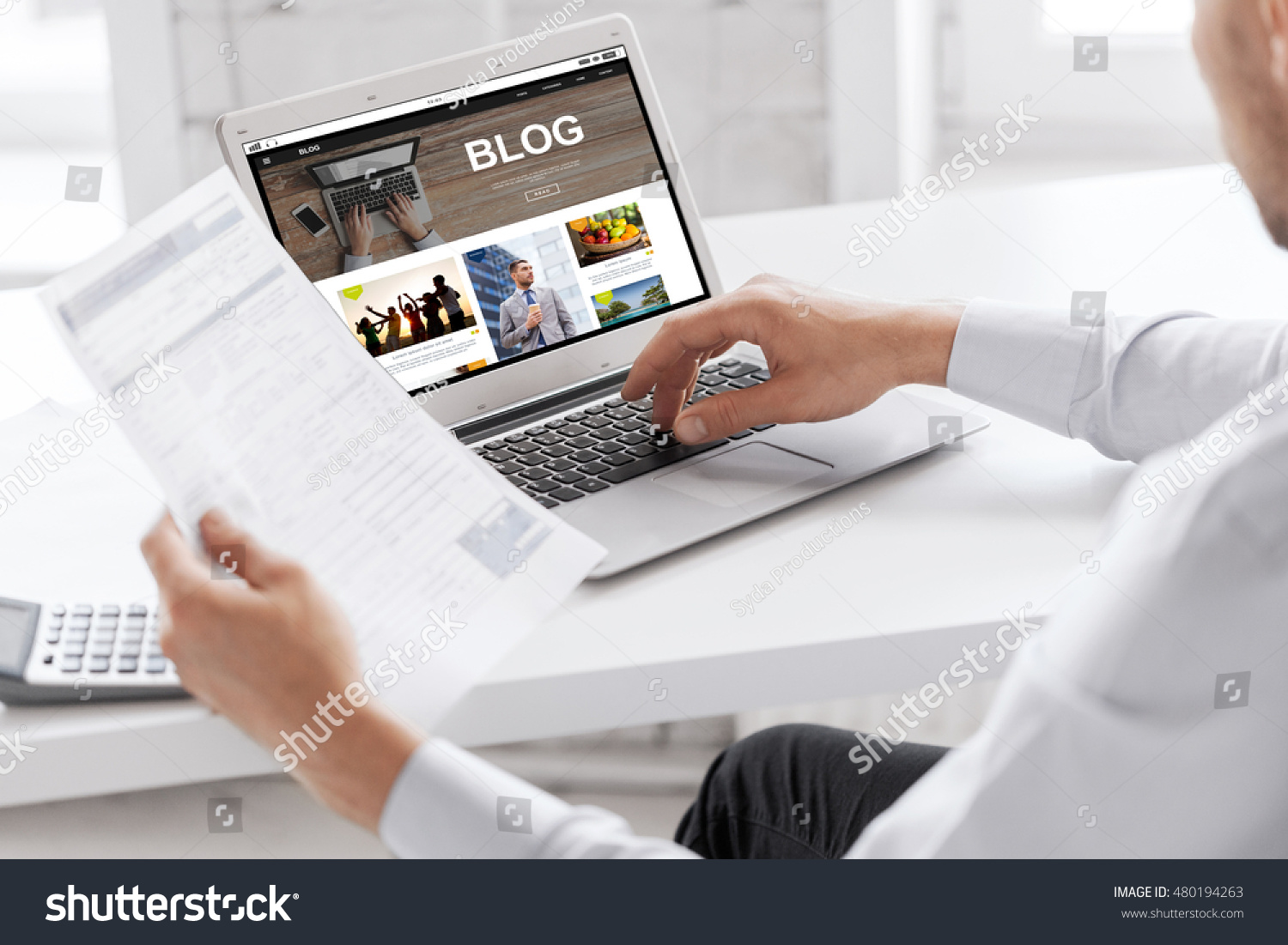 business, blogging, technology and people concept - businessman with internet blog page on laptop computer screen working at office #480194263