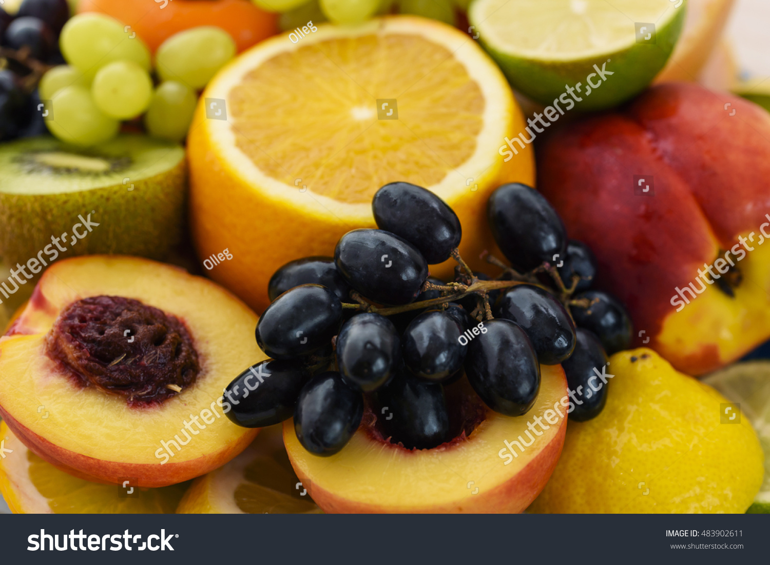 Fresh fruit slices. Grape, apple, kiwi fruits. Background of healthy fresh fruits #483902611
