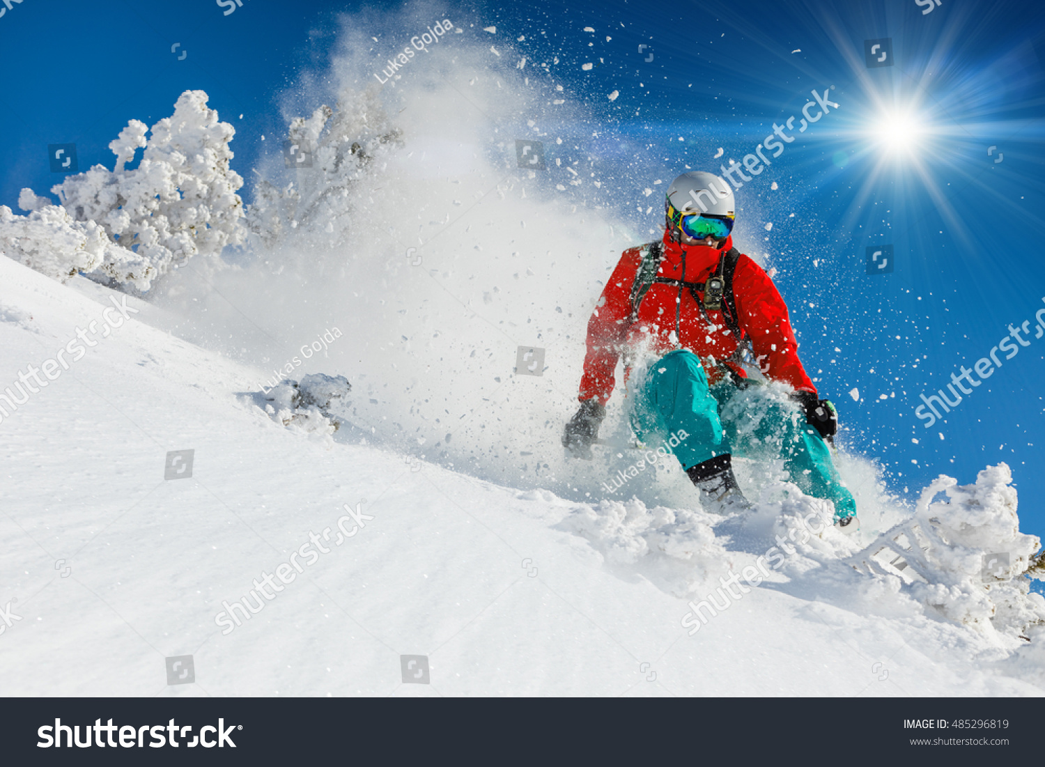 Skier skiing downhill in high mountains #485296819