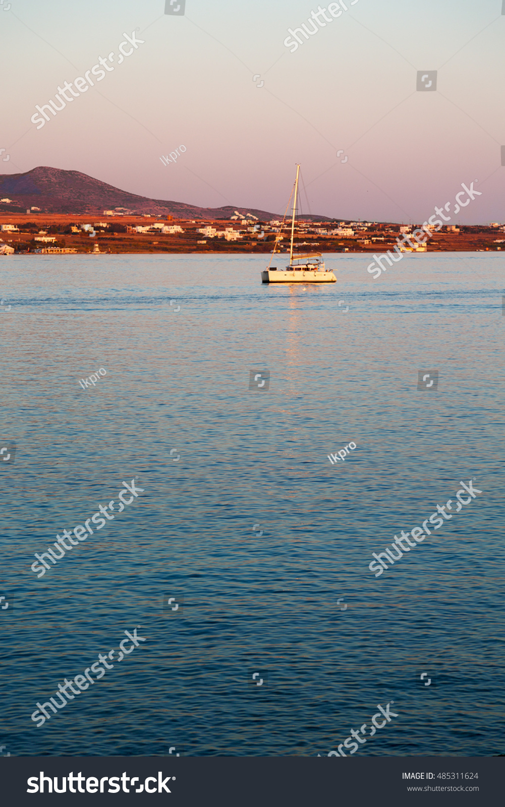 in greece near the coastline boat and yacht and sunrise light #485311624