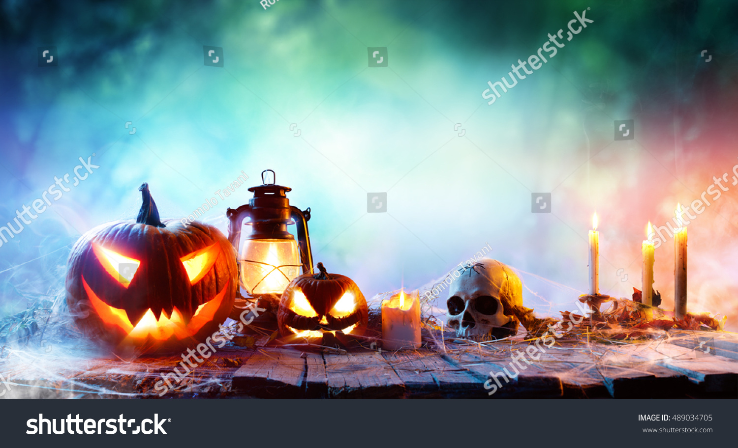 Halloween - Lanterns And Pumpkins On Wooden Table In A Haunted Forest
 #489034705