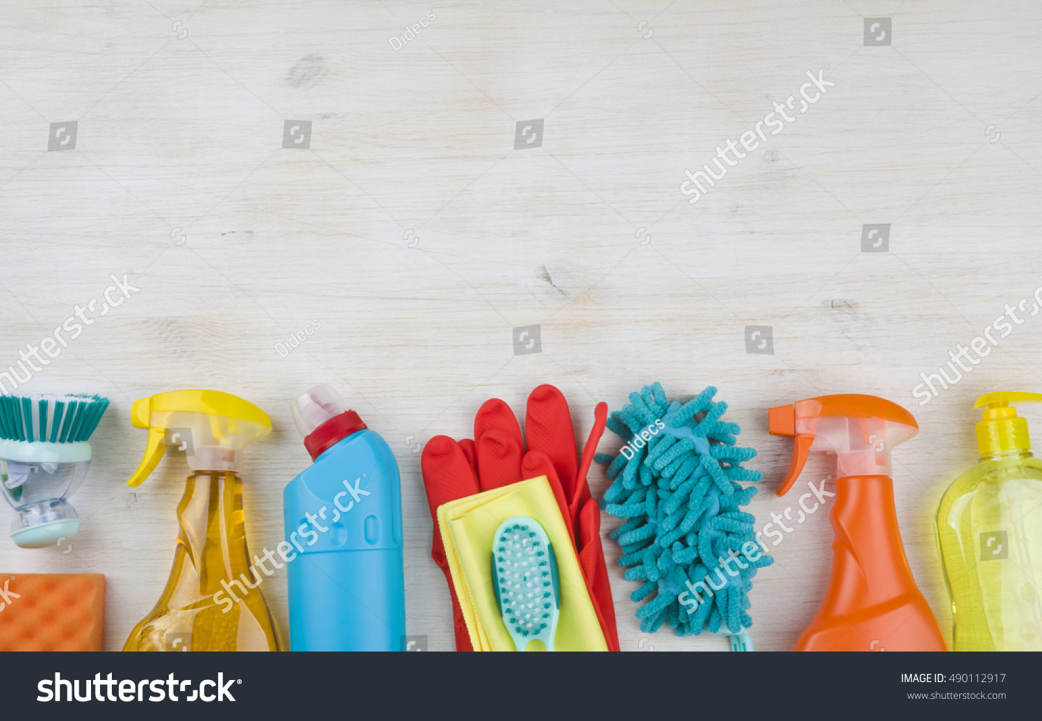 Household cleaning products on wooden background with copyspace at top #490112917