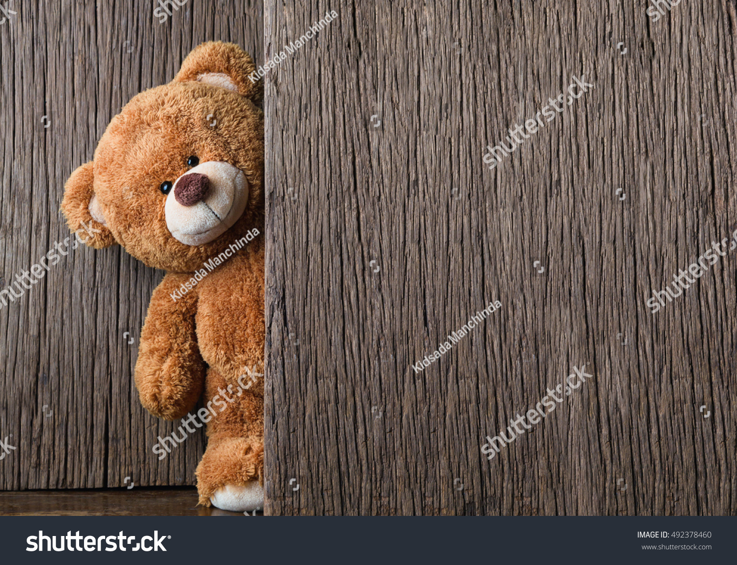 Cute teddy bear on old wood background with copy space #492378460