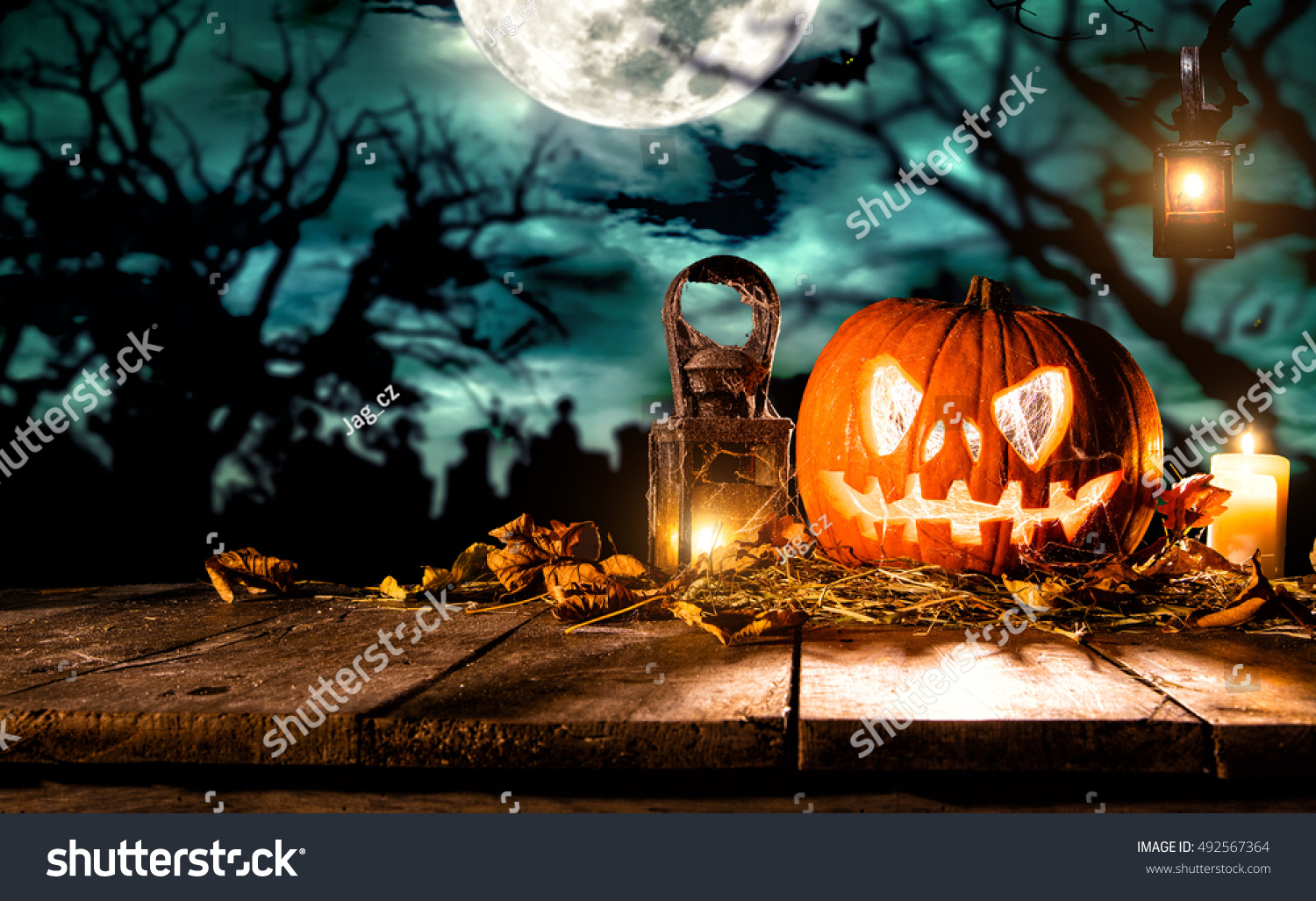 Scary halloween pumpkin on wooden planks. Empty space for text #492567364