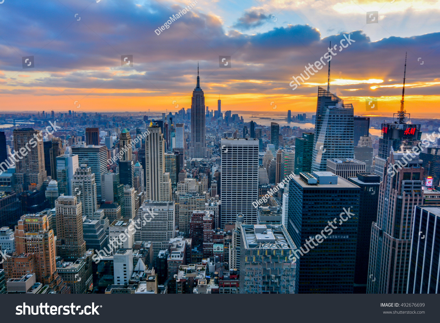 NEW YORK, UNITED STATES - DECEMBER 28, 2015 -  New York City skyline with urban skyscrapers at sunset. #492676699