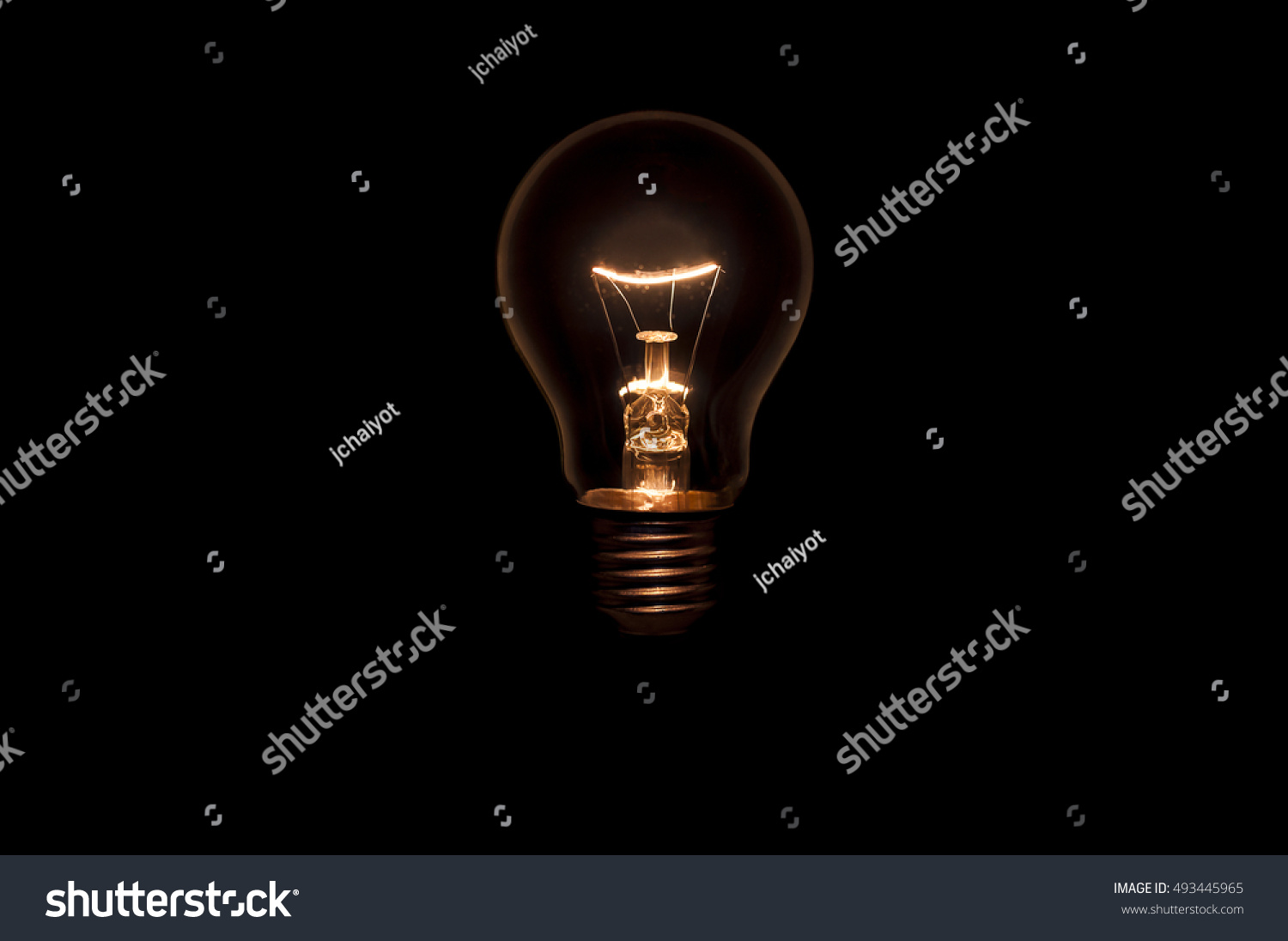 Tungsten light bulb without wiring and socket on black background. Concept for creative idea. #493445965
