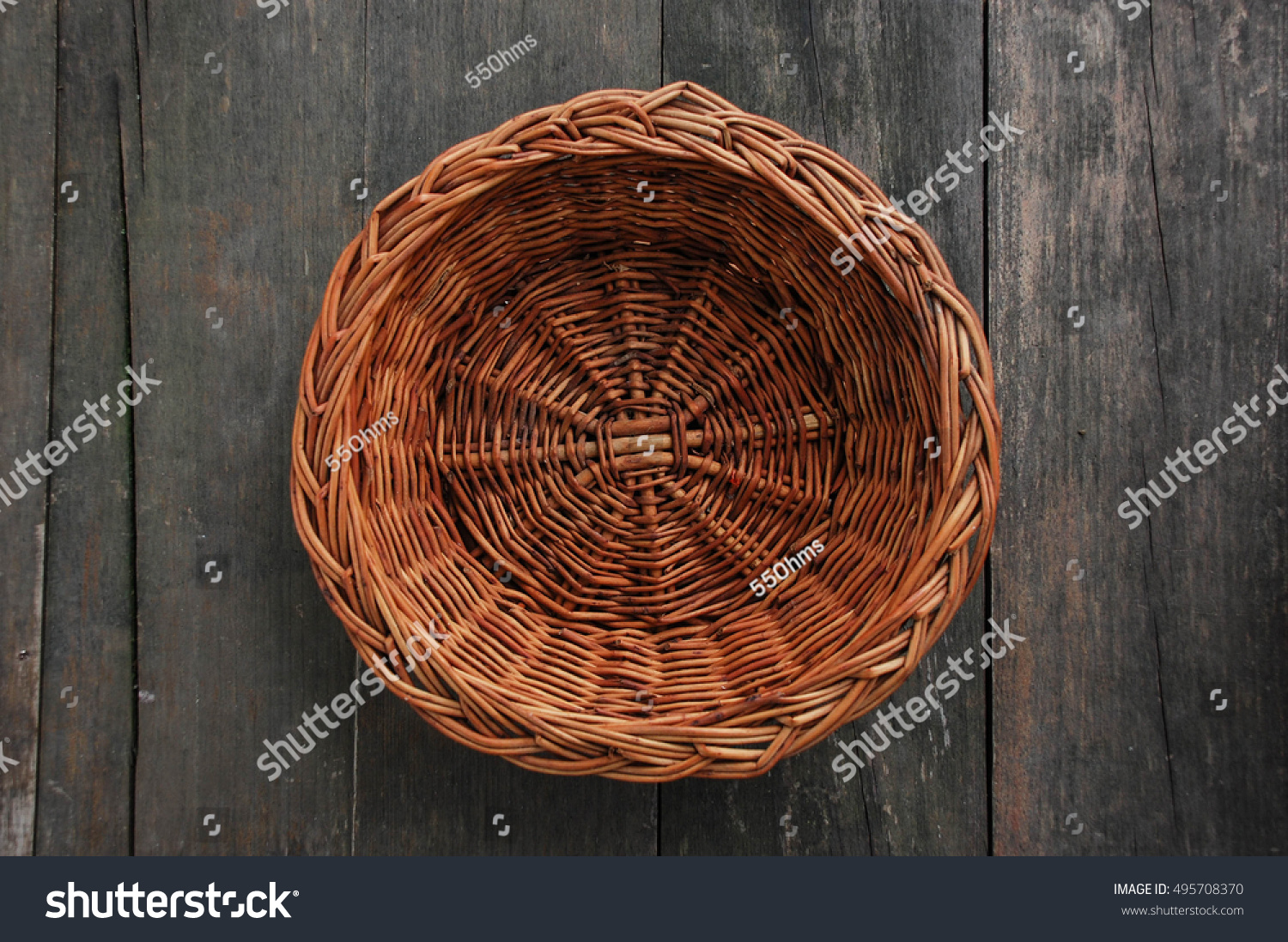 wood weave fruit basket on wood texture, top view #495708370