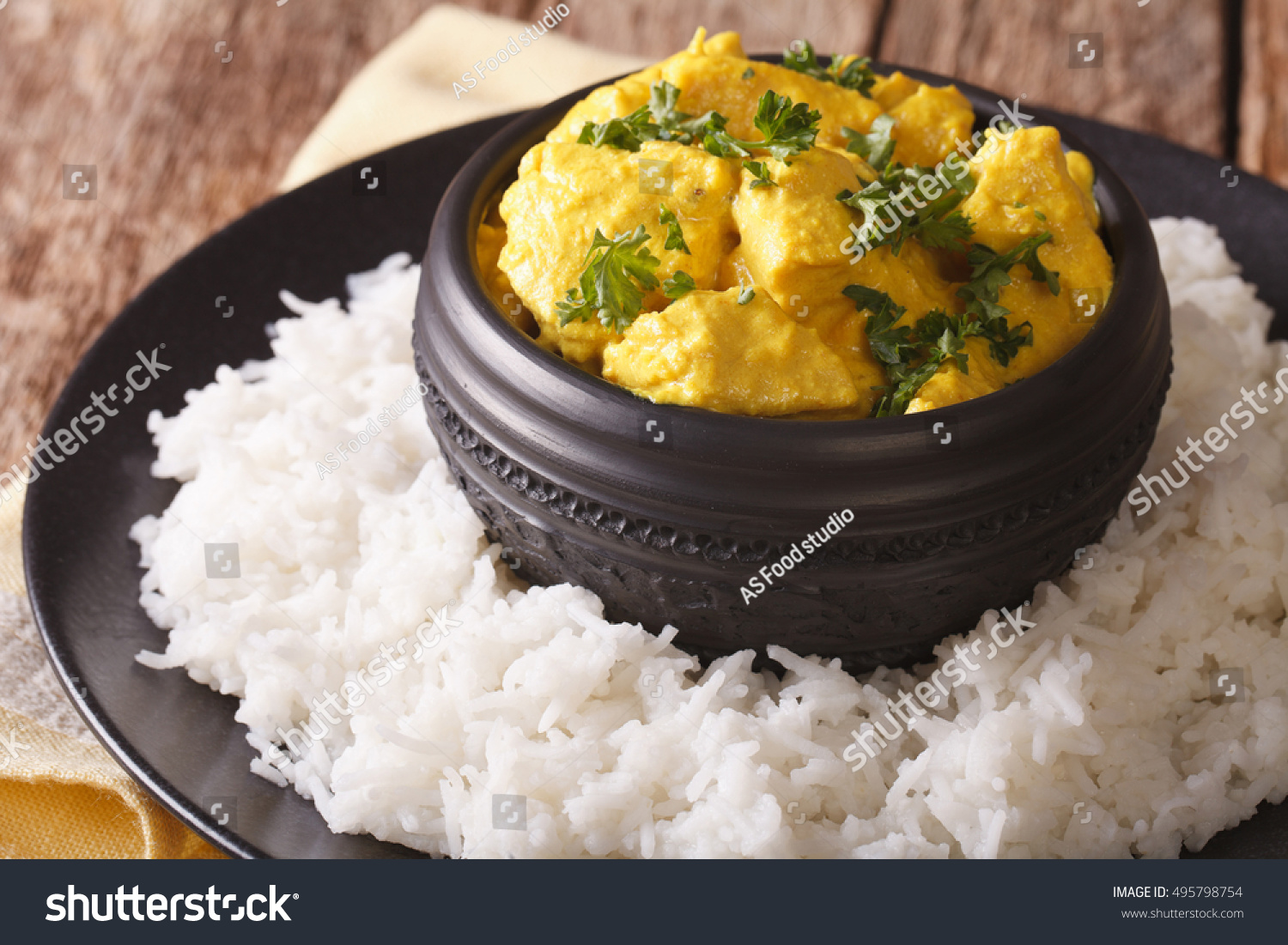 Indian chicken Korma with basmati rice close-up on the table. horizontal
 #495798754