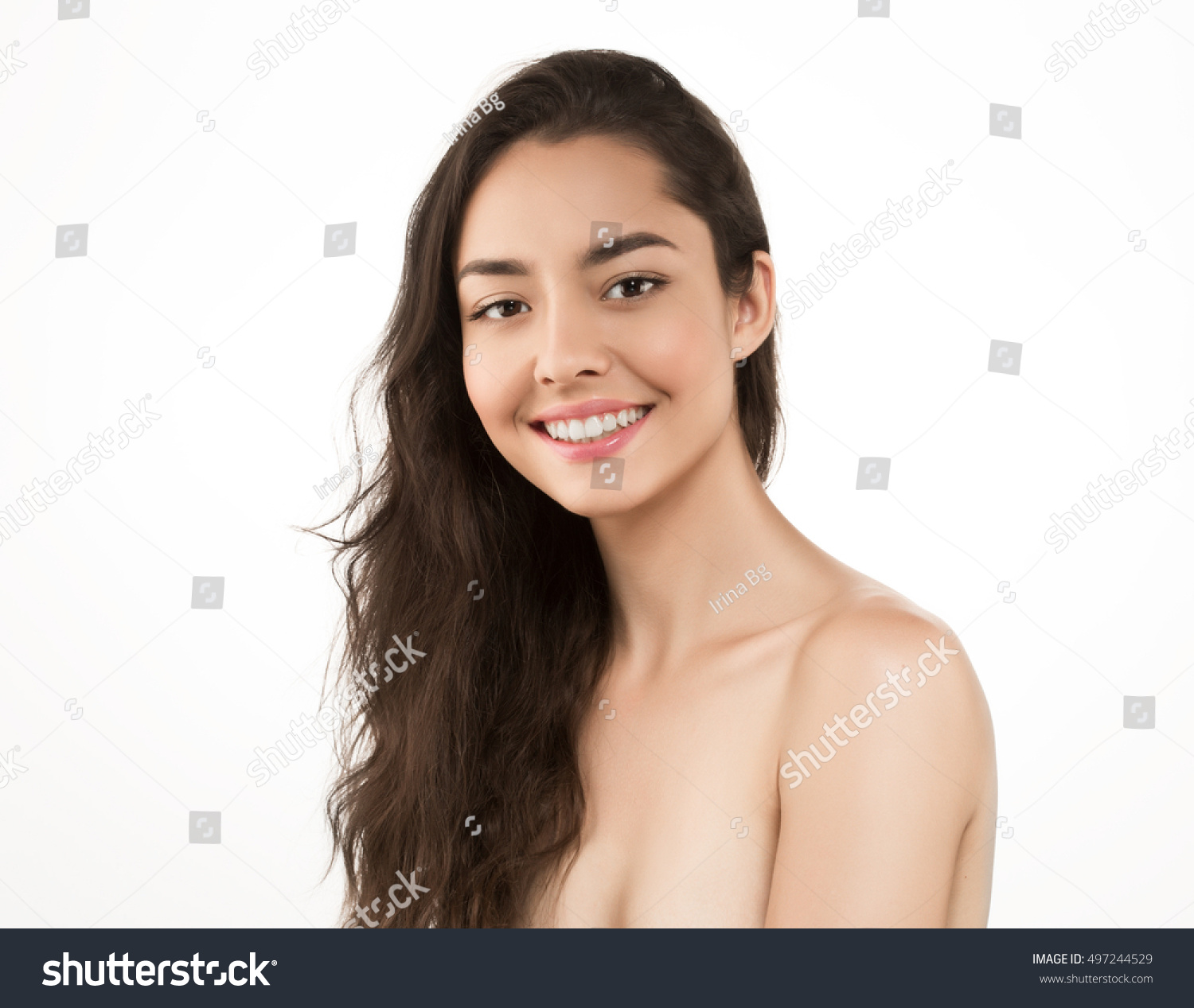 Beauty Woman face Portrait. Beautiful Spa model Girl with Perfect Fresh Clean Skin. Brunette female looking at camera and smiling. Youth and Skin Care Concept  #497244529