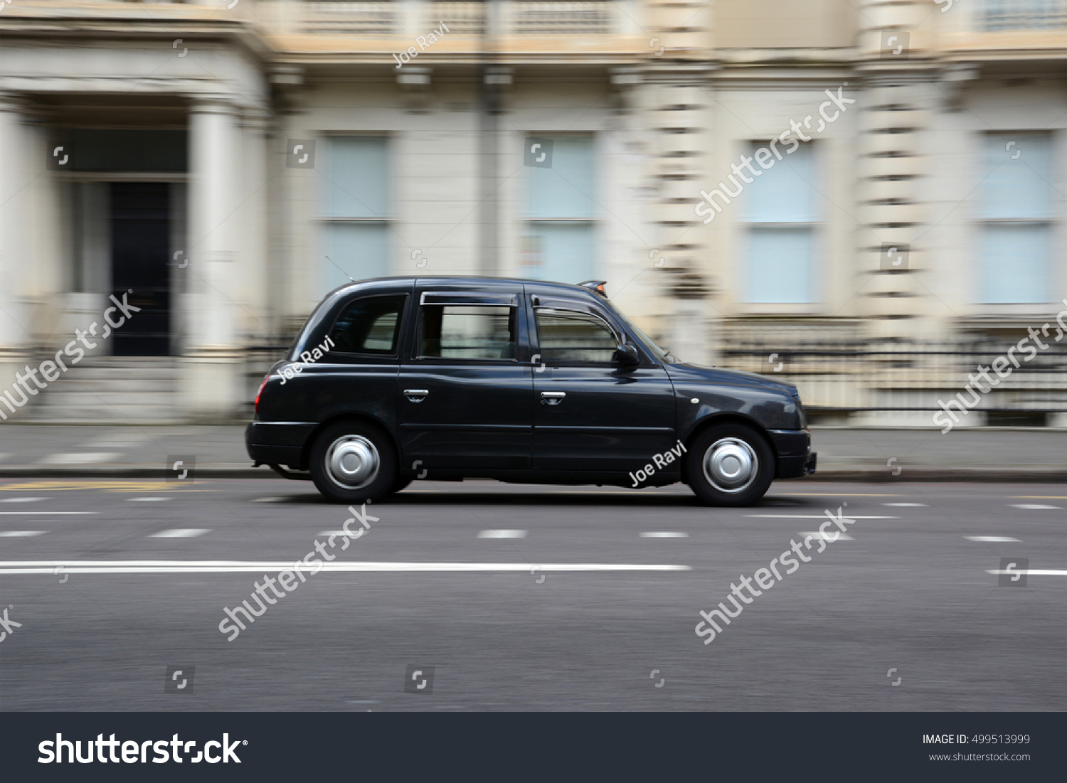Panning shot of a black taxi in London. #499513999