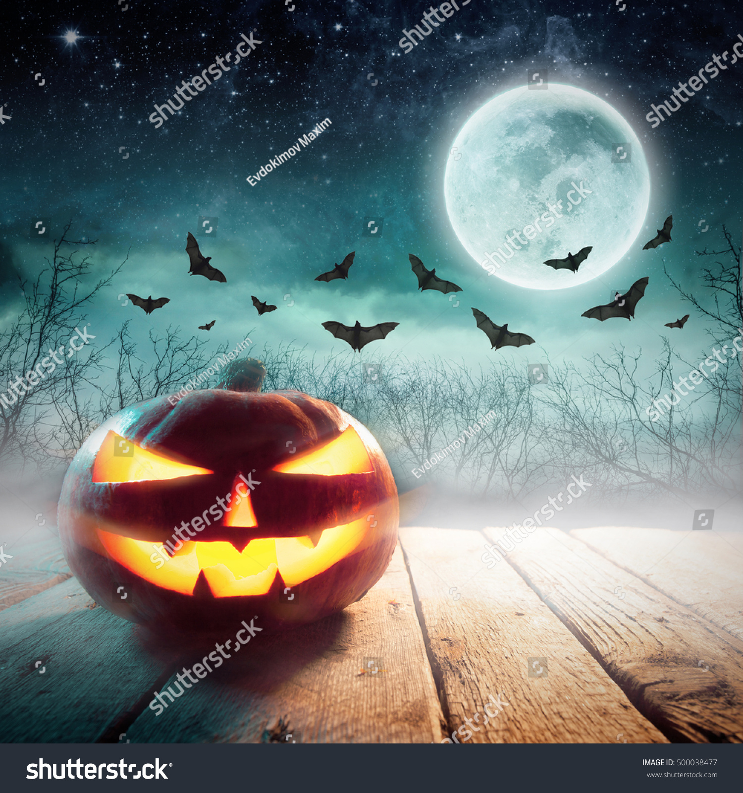 Halloween Pumpkin in a dark mist Forest. Studio shot. Elements of this image furnished by NASA #500038477