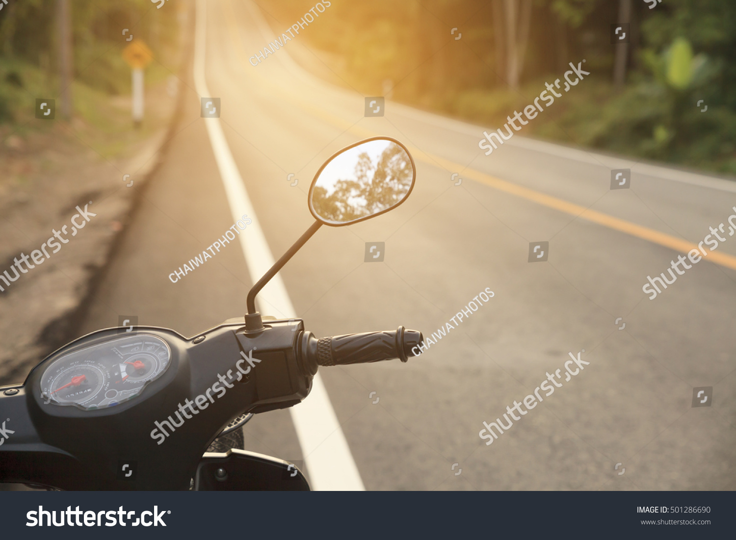 Handlebars of motorcycle on sunset. #501286690