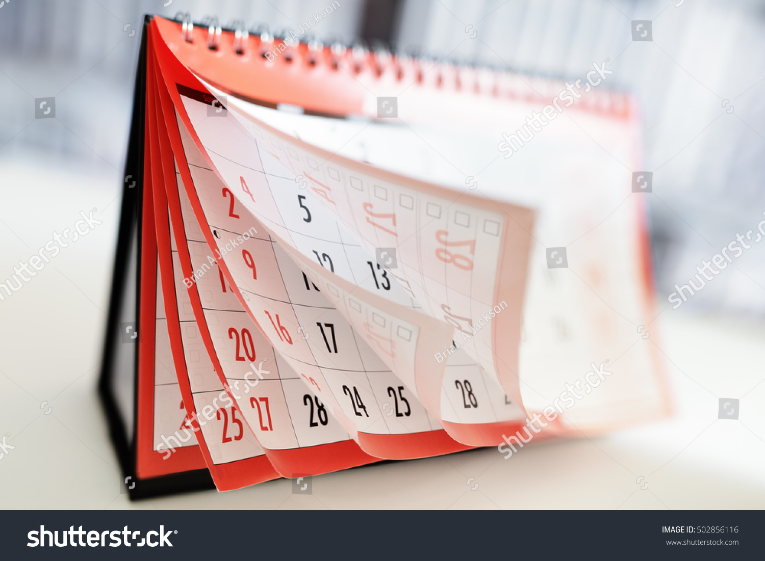 Months and dates shown on a calendar whilst turning the pages #502856116