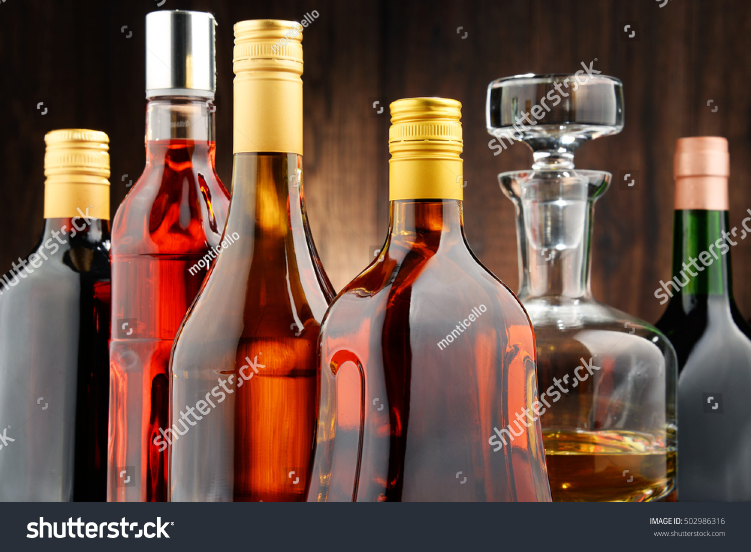 Composition with bottles of assorted alcoholic beverages. #502986316
