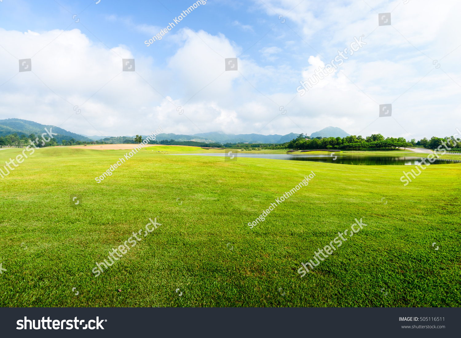 green grass field on blue sky with cloud background #505116511