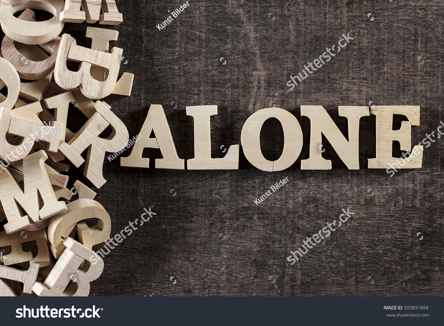 ALONE word made with wooden letters #505891894