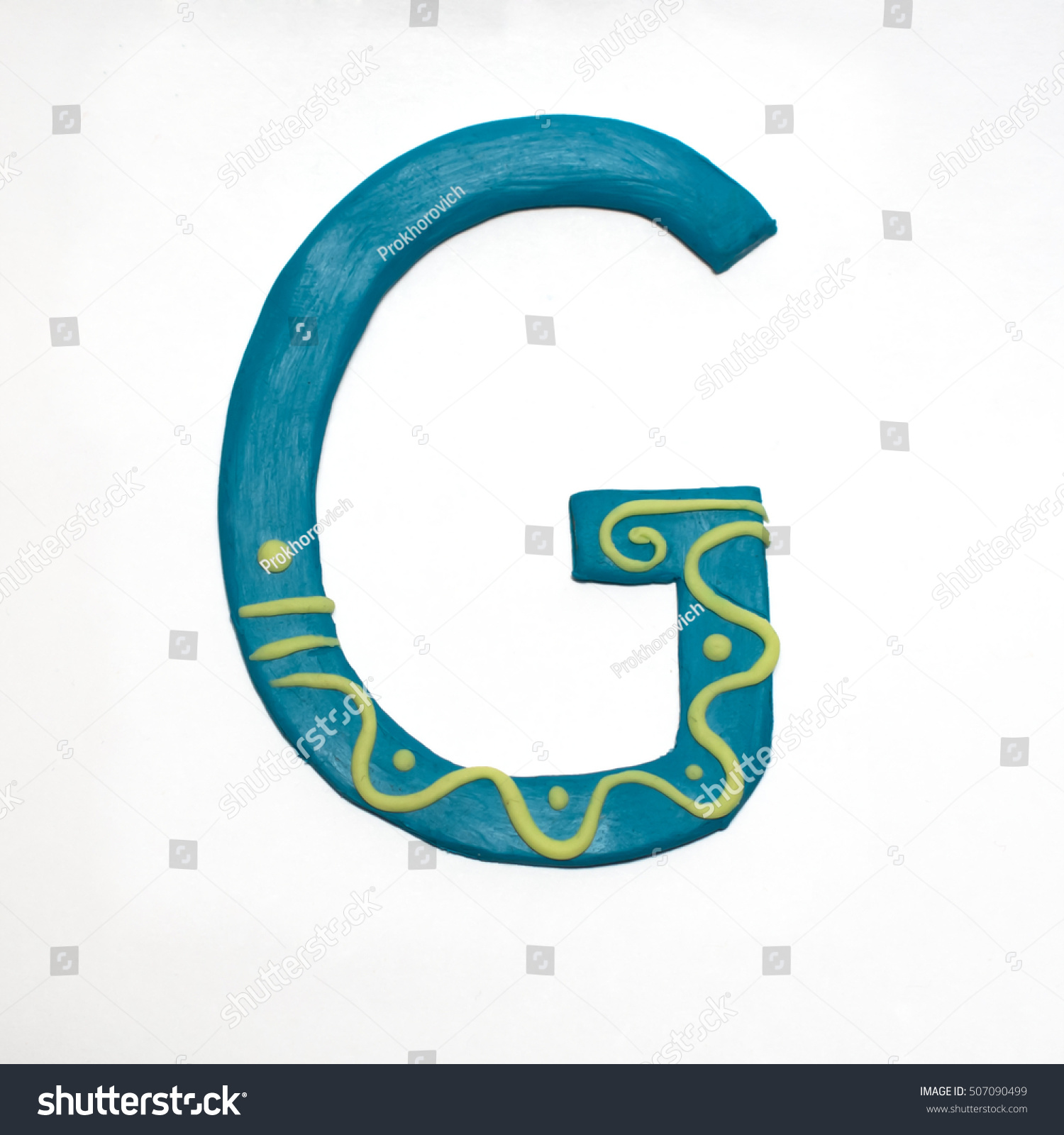 
Colorful font fashioned from clay. Letter "G". Isolated letter on a white background. #507090499