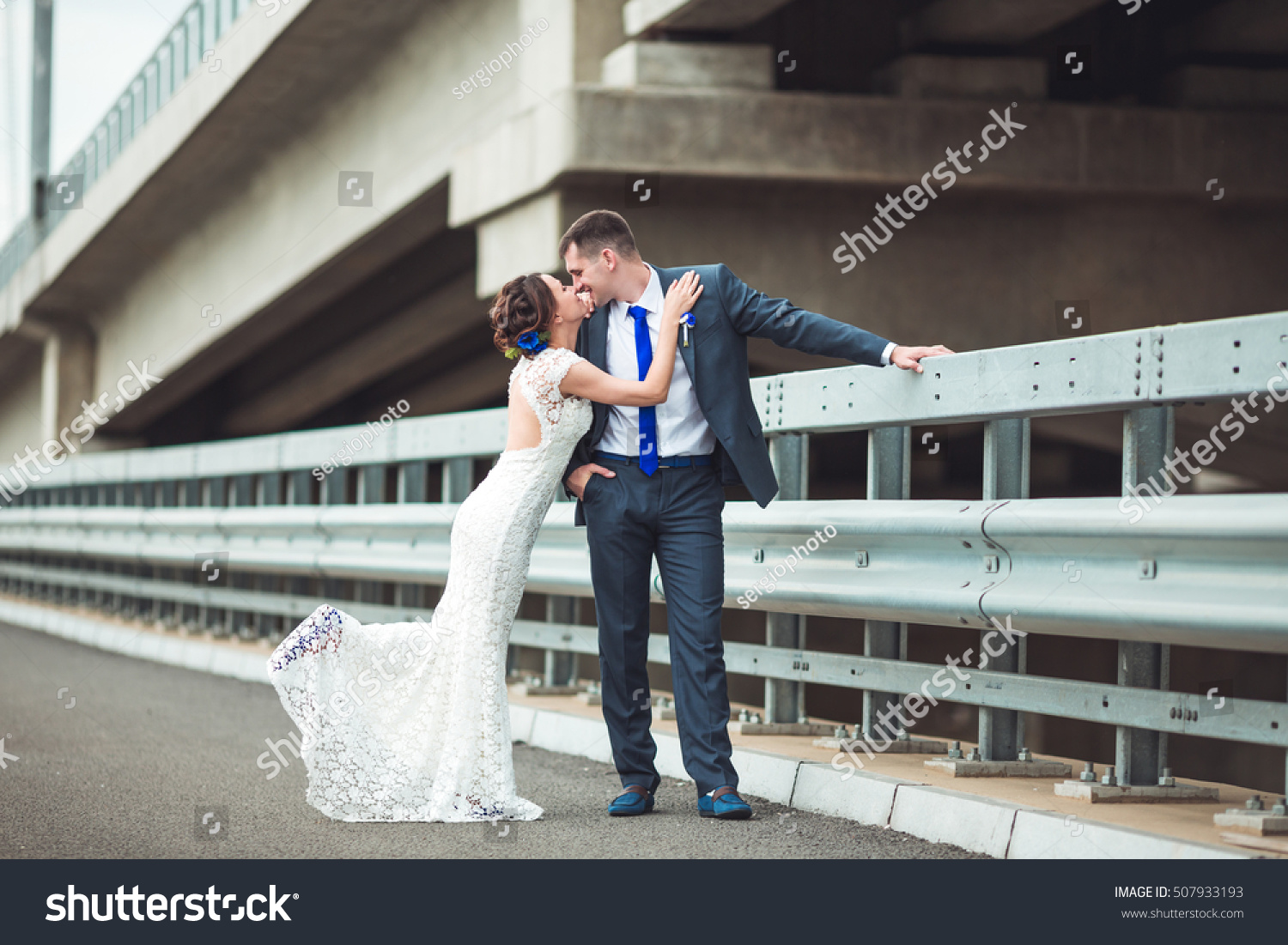 Happy bride and groom celebrating wedding day. Kissing married couple. Long family life concept #507933193