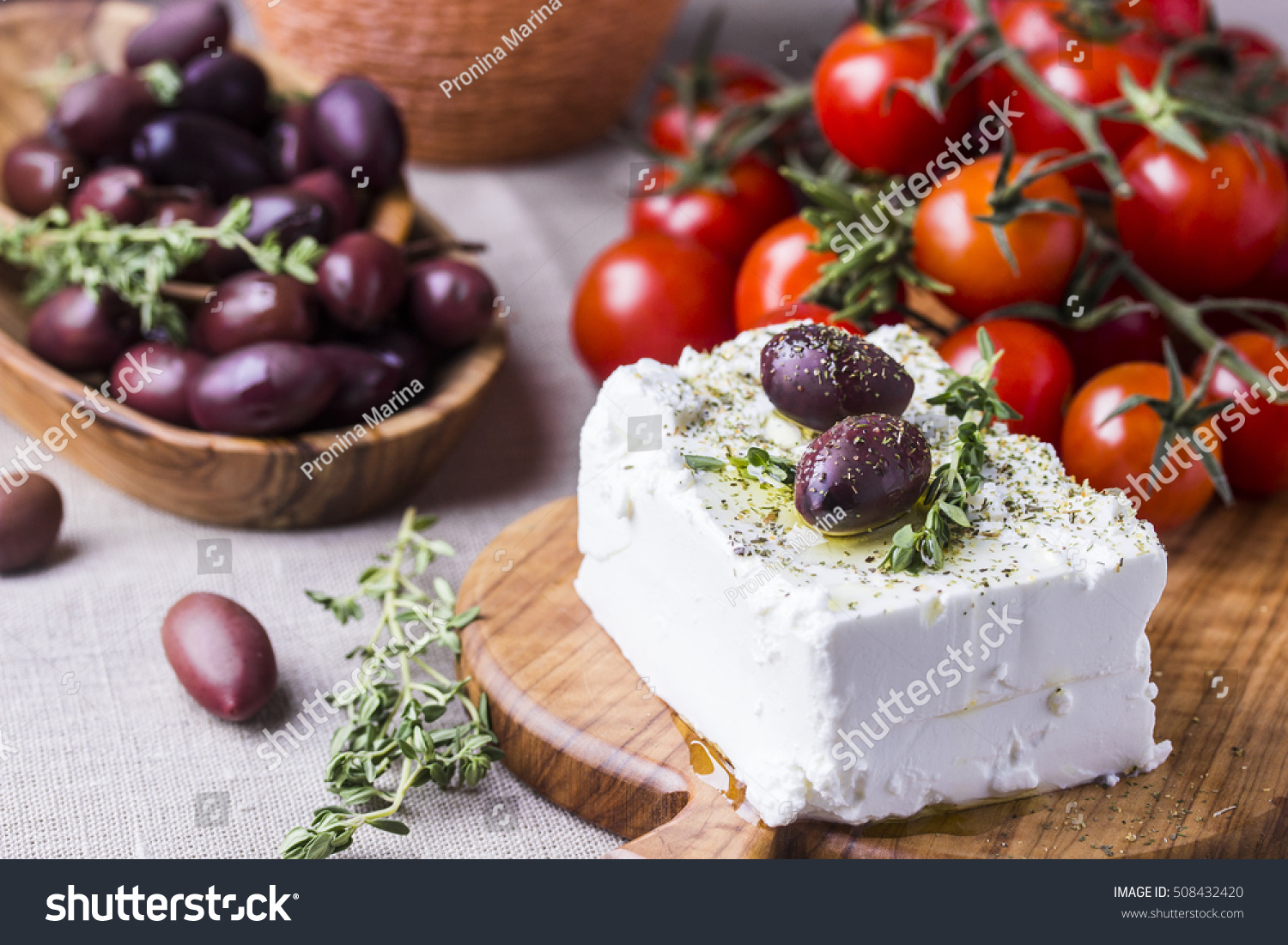 Greek cheese feta with thyme and olives, selective focus #508432420
